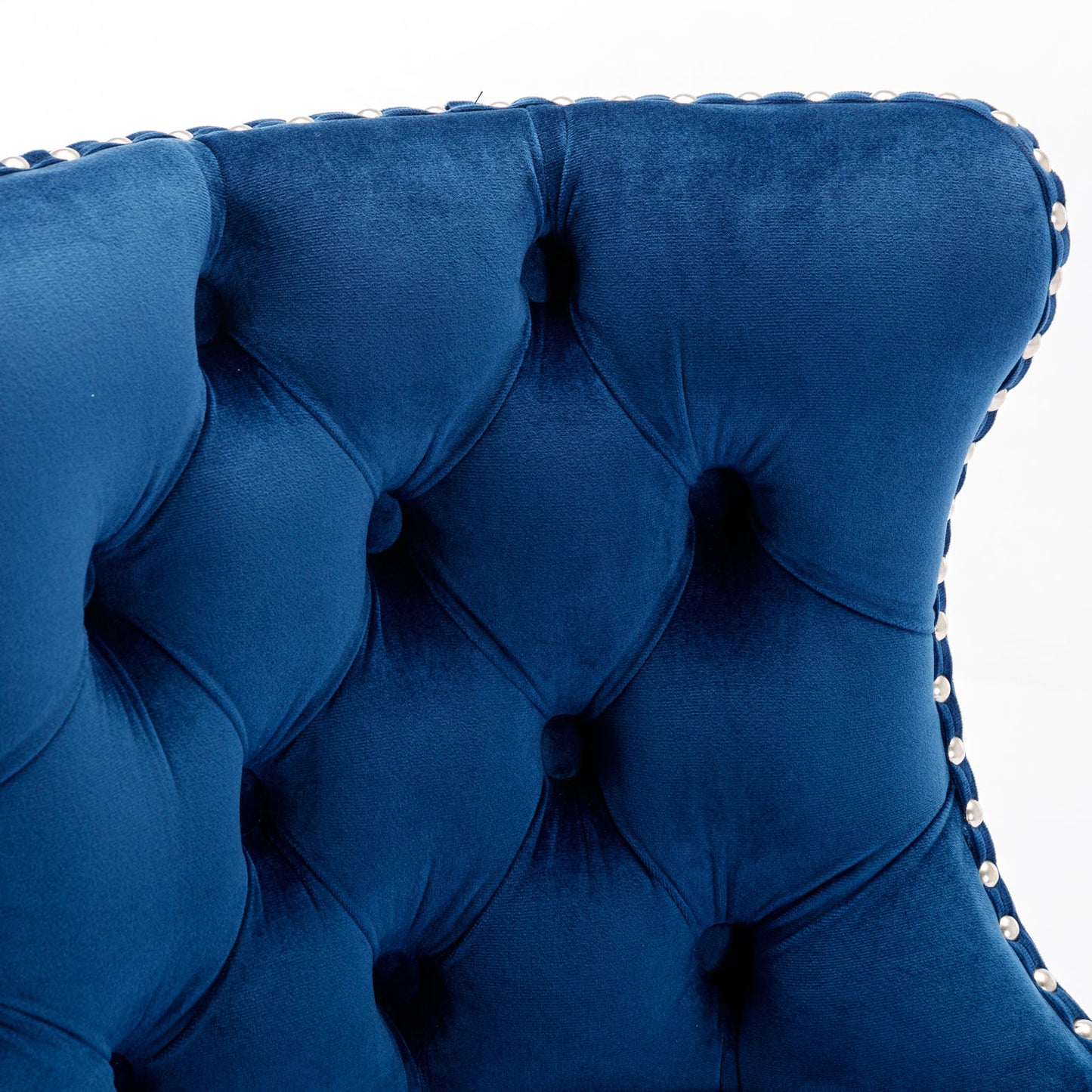 Deep blue velvet tufted armchair detail
