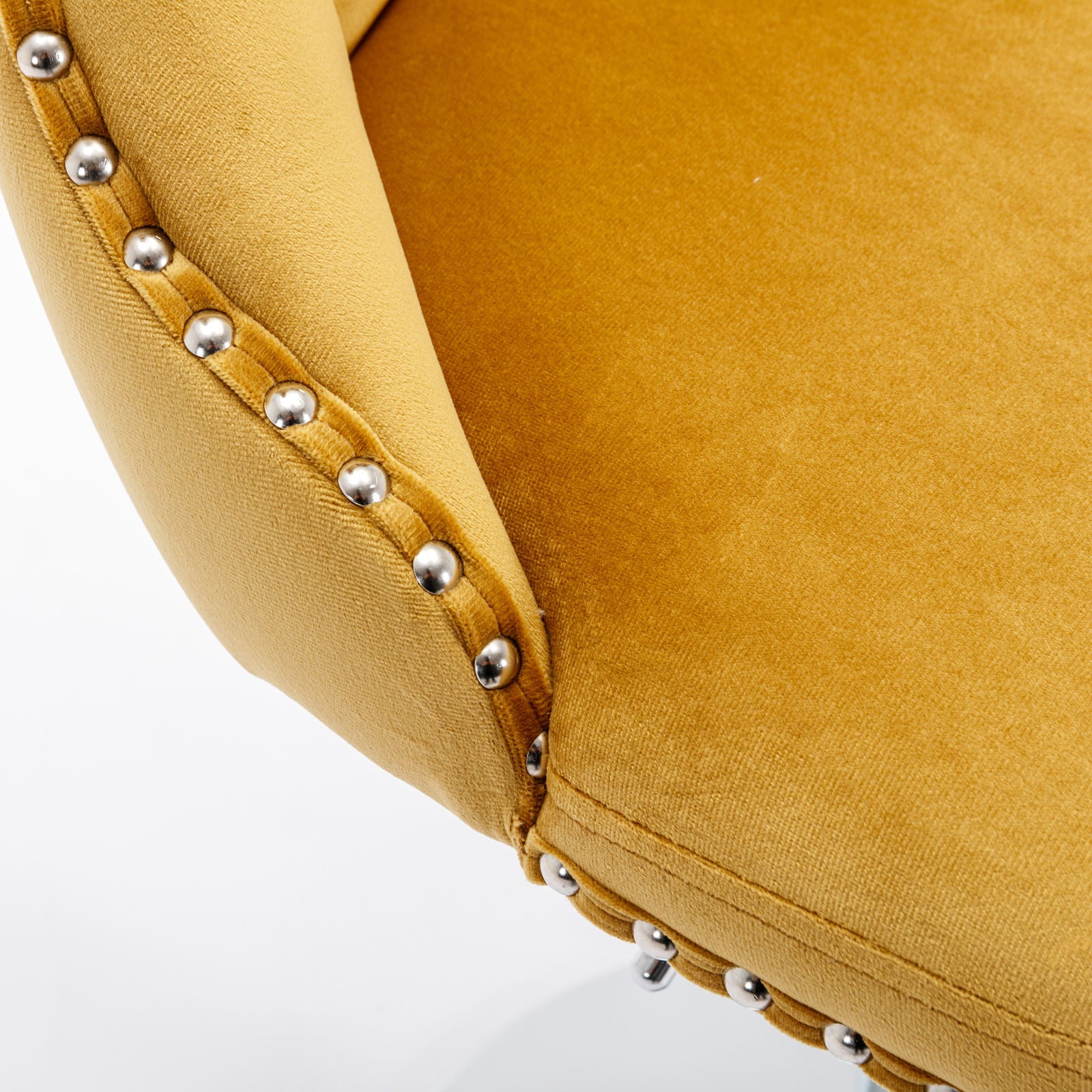 Yellow velvet armchair with polished silver nailhead trim