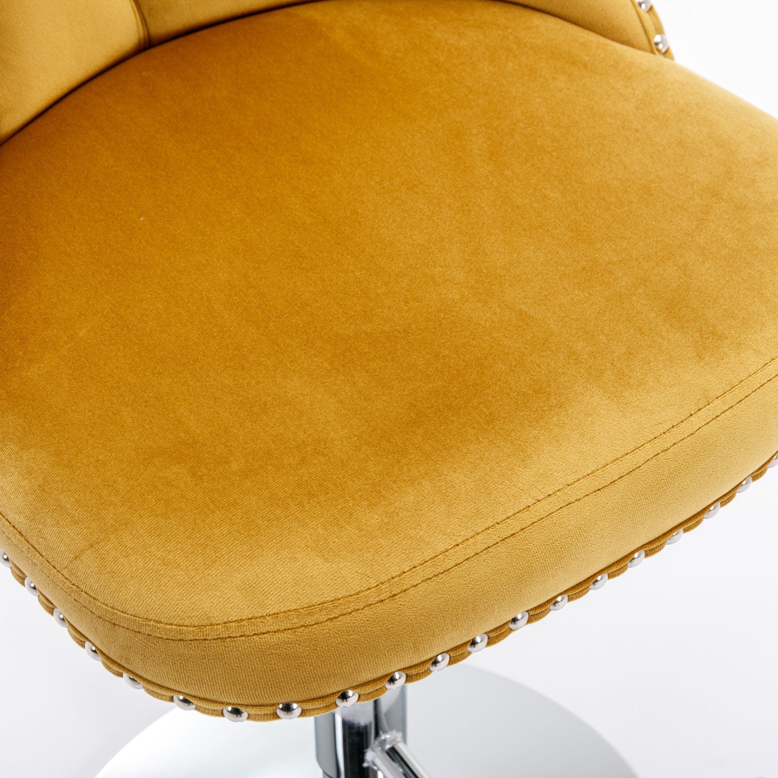 Plush mustard yellow velvet bar stool cushion with decorative silver nailhead trim