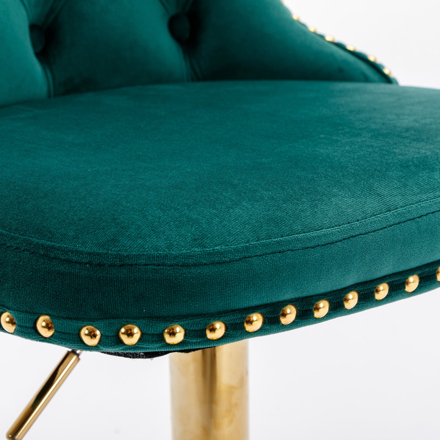 Emerald green velvet bar stool with gold nailhead trim