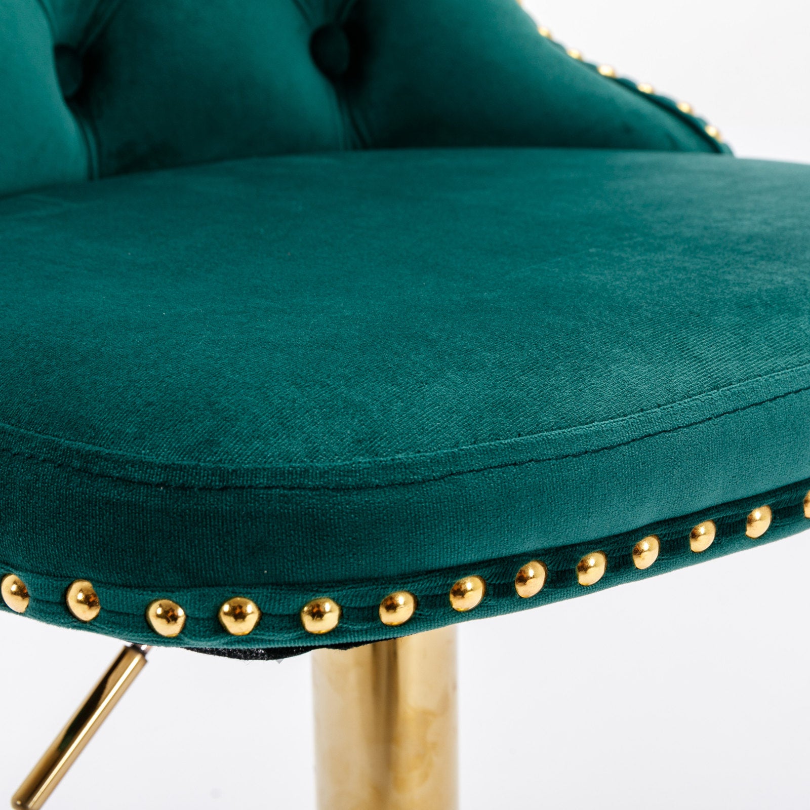 Emerald green velvet bar stool with gold nailhead trim