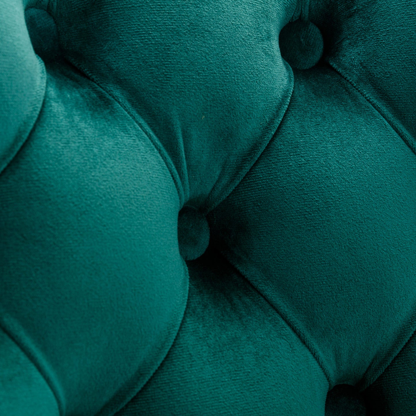 Teal velvet tufted upholstery detail