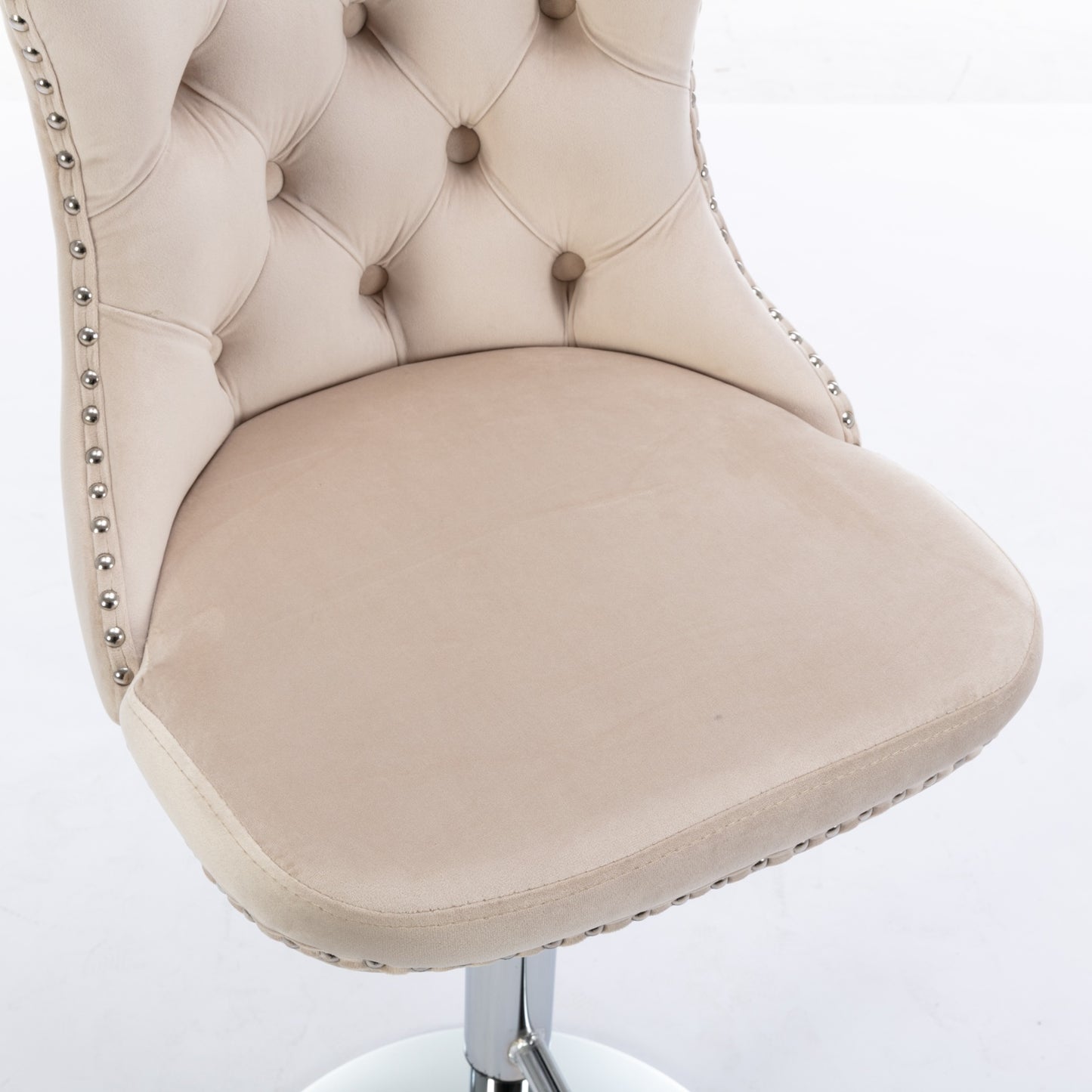 Beige velvet tufted bar stool with chrome nailhead trim and adjustable height base
