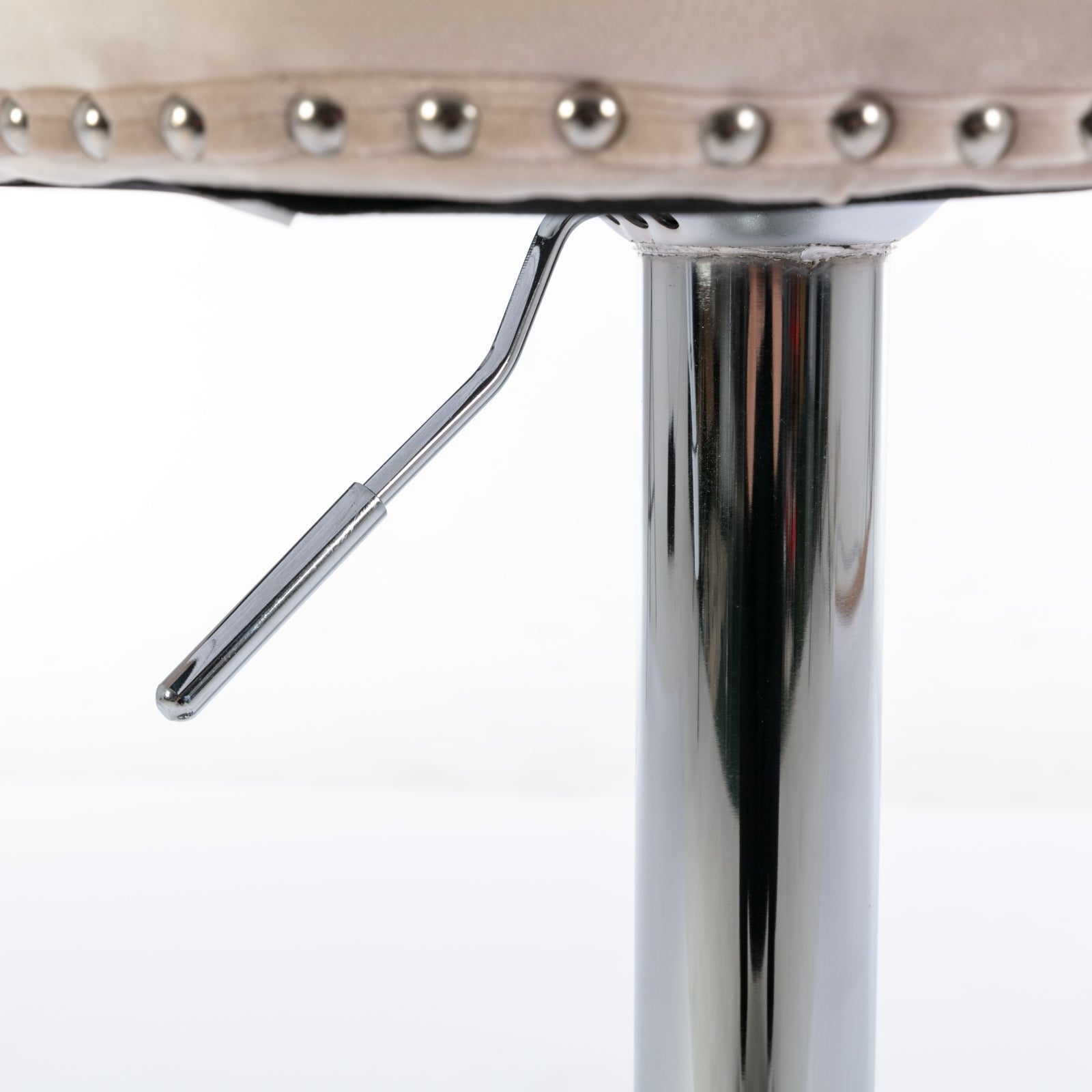 Cream upholstered bar stool seat with decorative studs and chrome lever