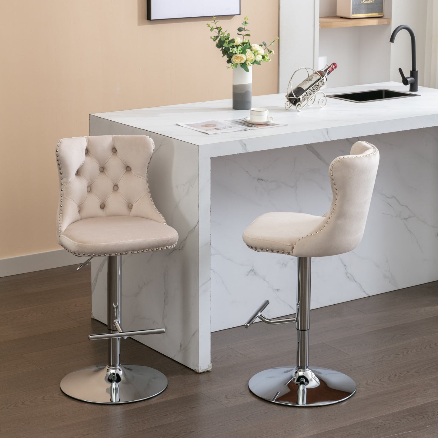 Beige velvet tufted bar stool with silver nailhead trim and adjustable height