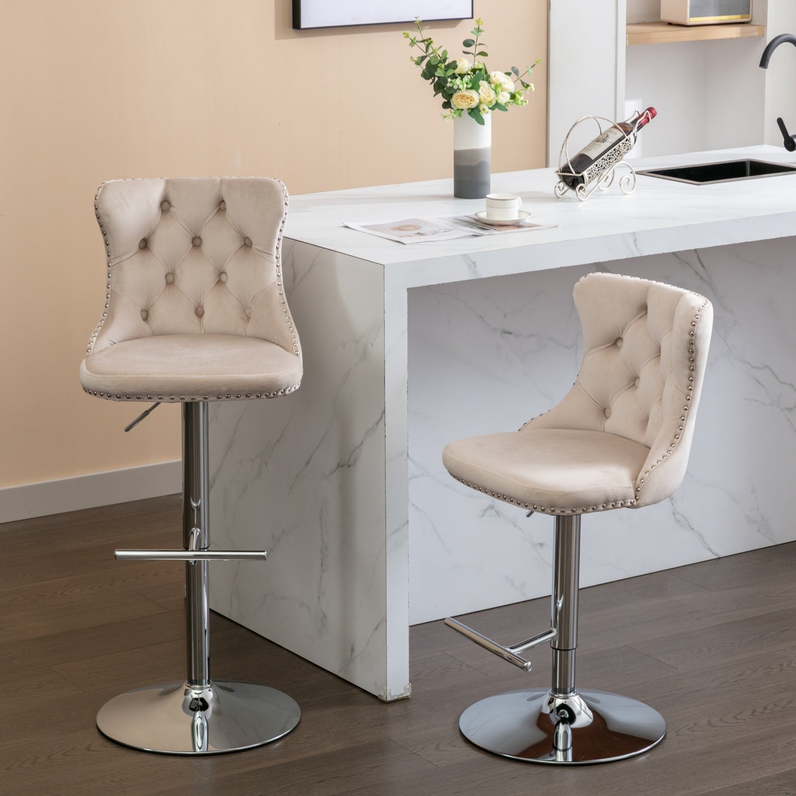Beige velvet tufted bar stool with silver nailhead trim and chrome base