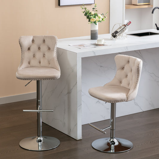 Beige velvet tufted bar stool with silver nailhead trim and chrome base