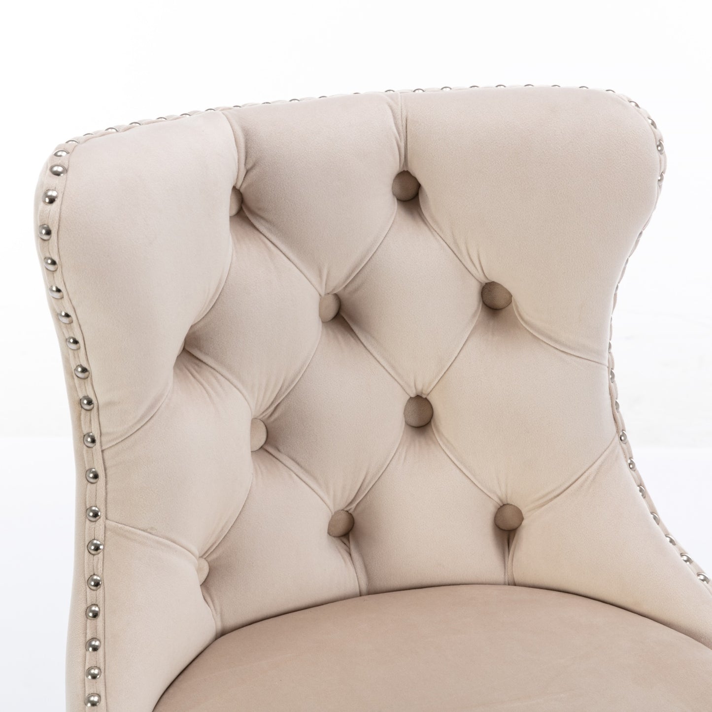 Beige velvet accent chair with diamond tufting and nailhead trim