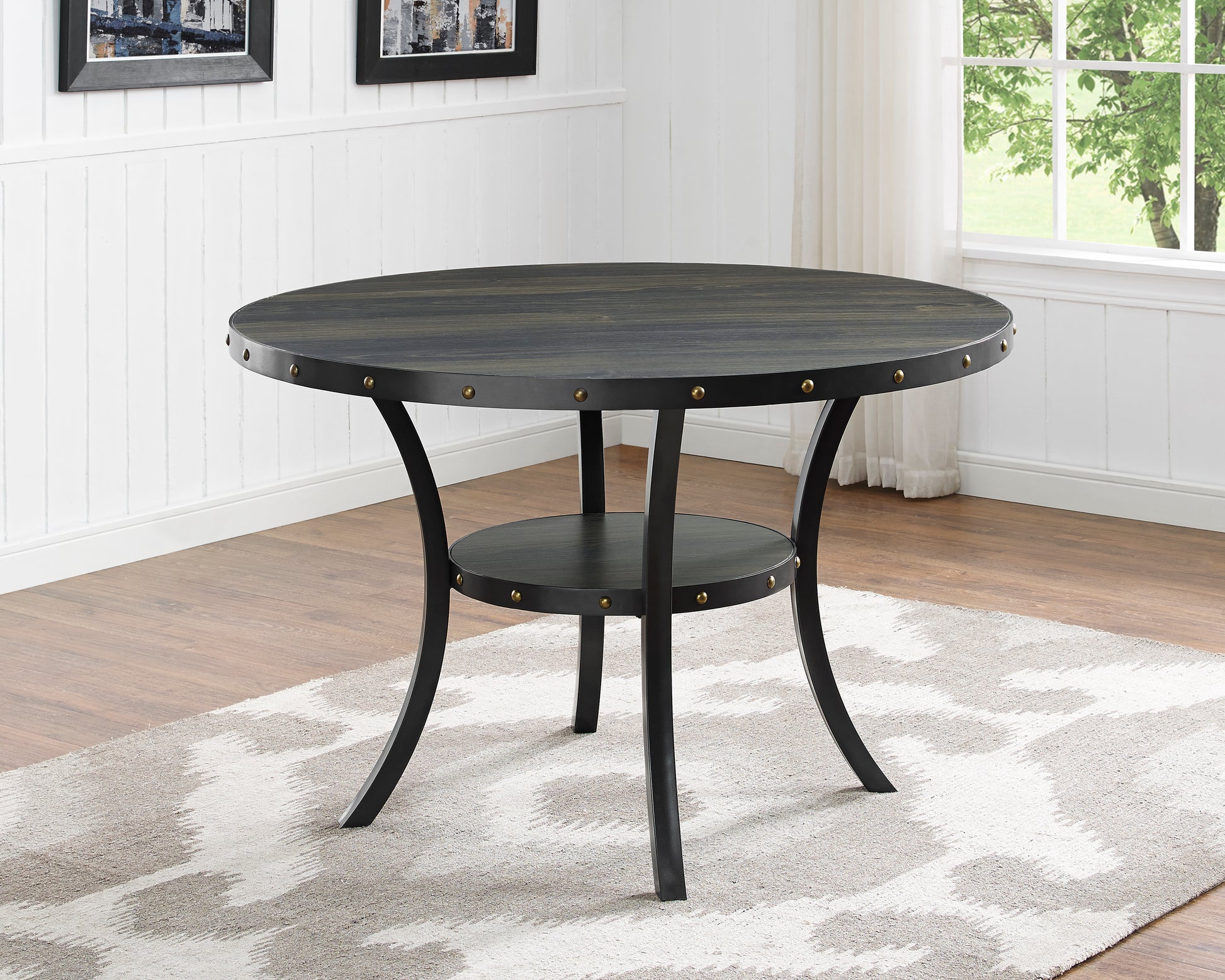 Round wood dining table with dark finish and metal legs