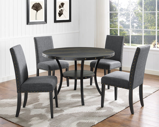 Dark wood round dining table with four upholstered gray chairs