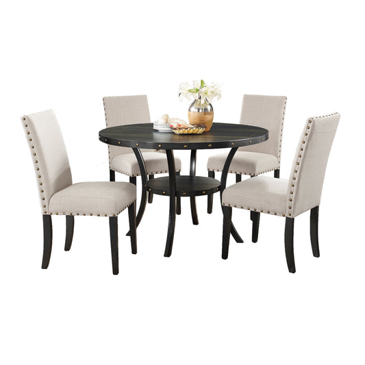 Round black wood dining table with four neutral linen chairs