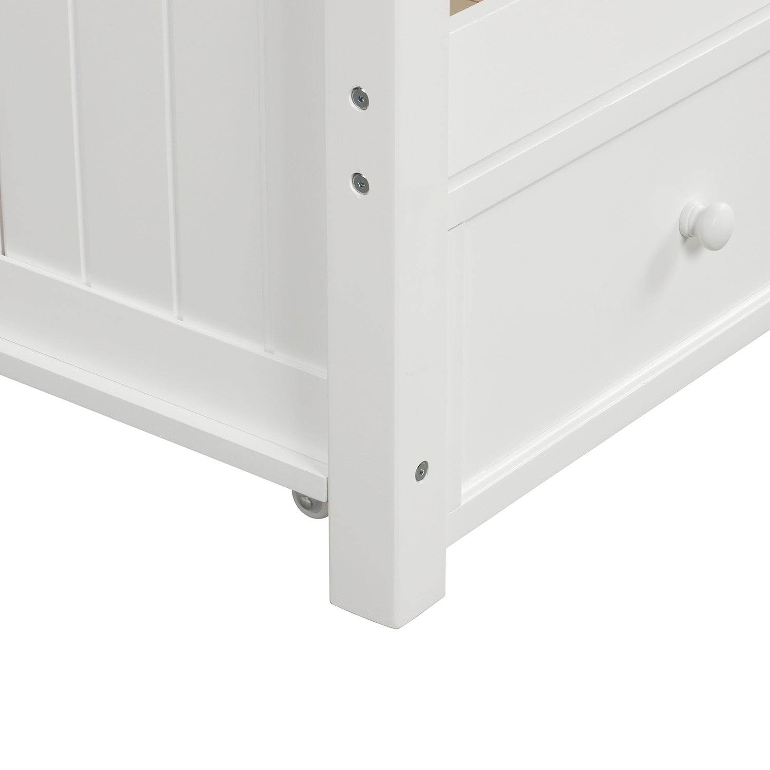 White wooden bed frame corner with a visible drawer and knob