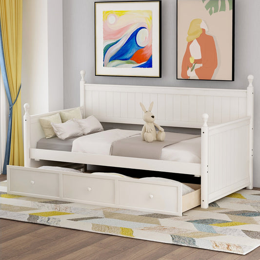 White wooden daybed with pullout trundle and three storage drawers