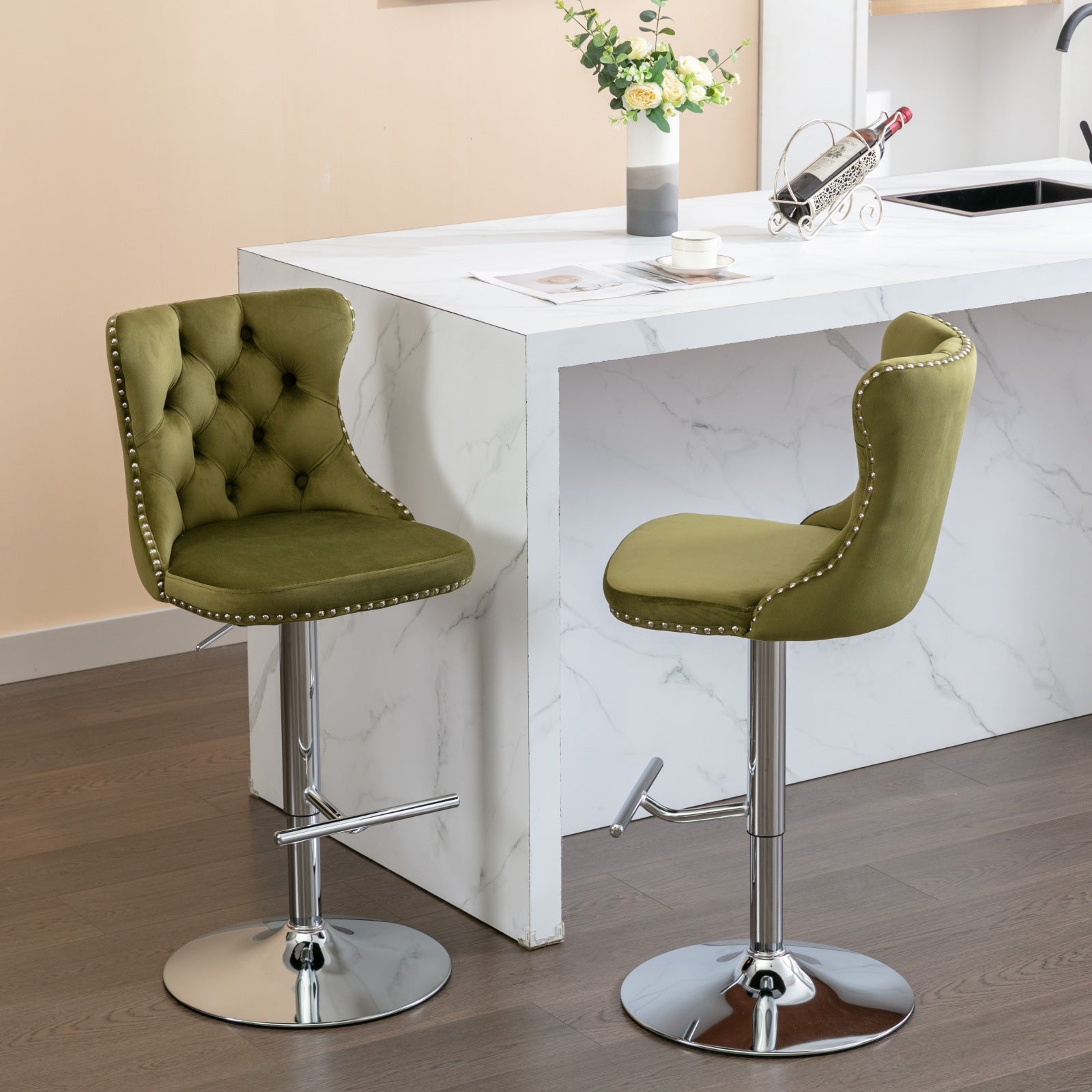 Green velvet tufted bar stool with silver nailhead trim and adjustable height