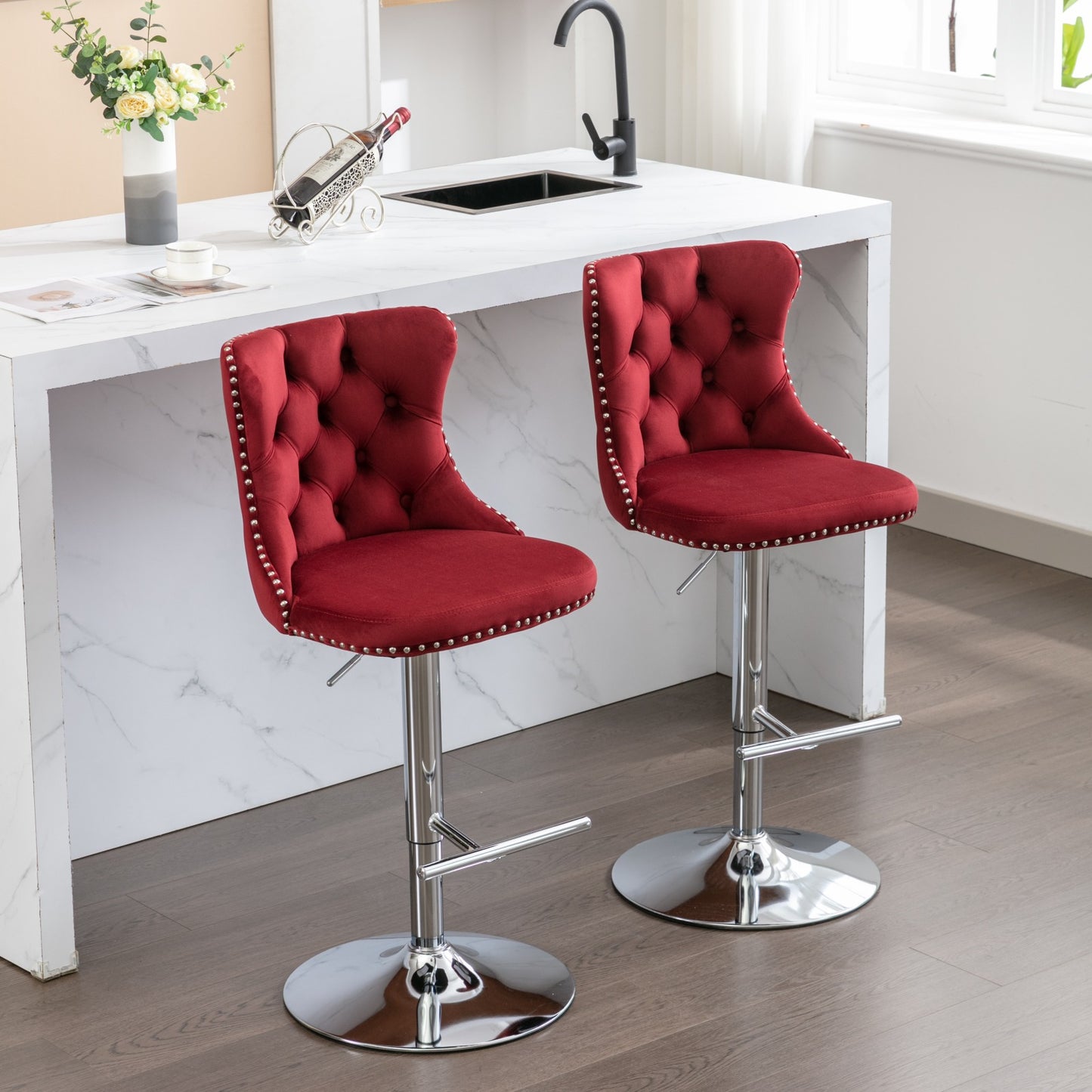 Red velvet tufted bar stool with silver nailhead trim and chrome base