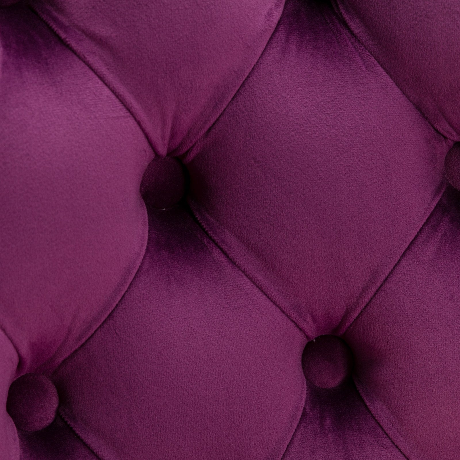 Deep purple velvet tufted upholstery fabric with diamond stitching