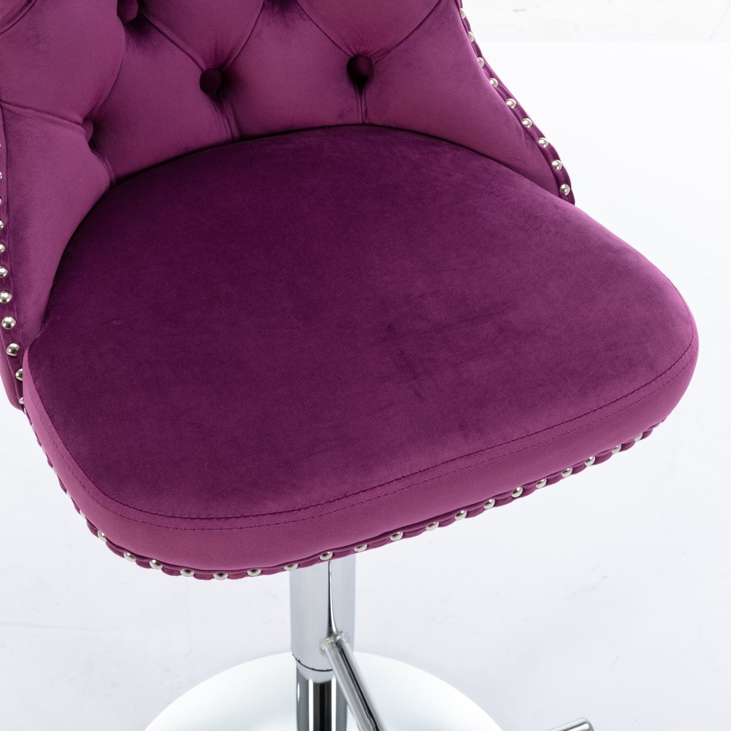 Plush purple velvet bar stool with button tufting and silver nailhead trim