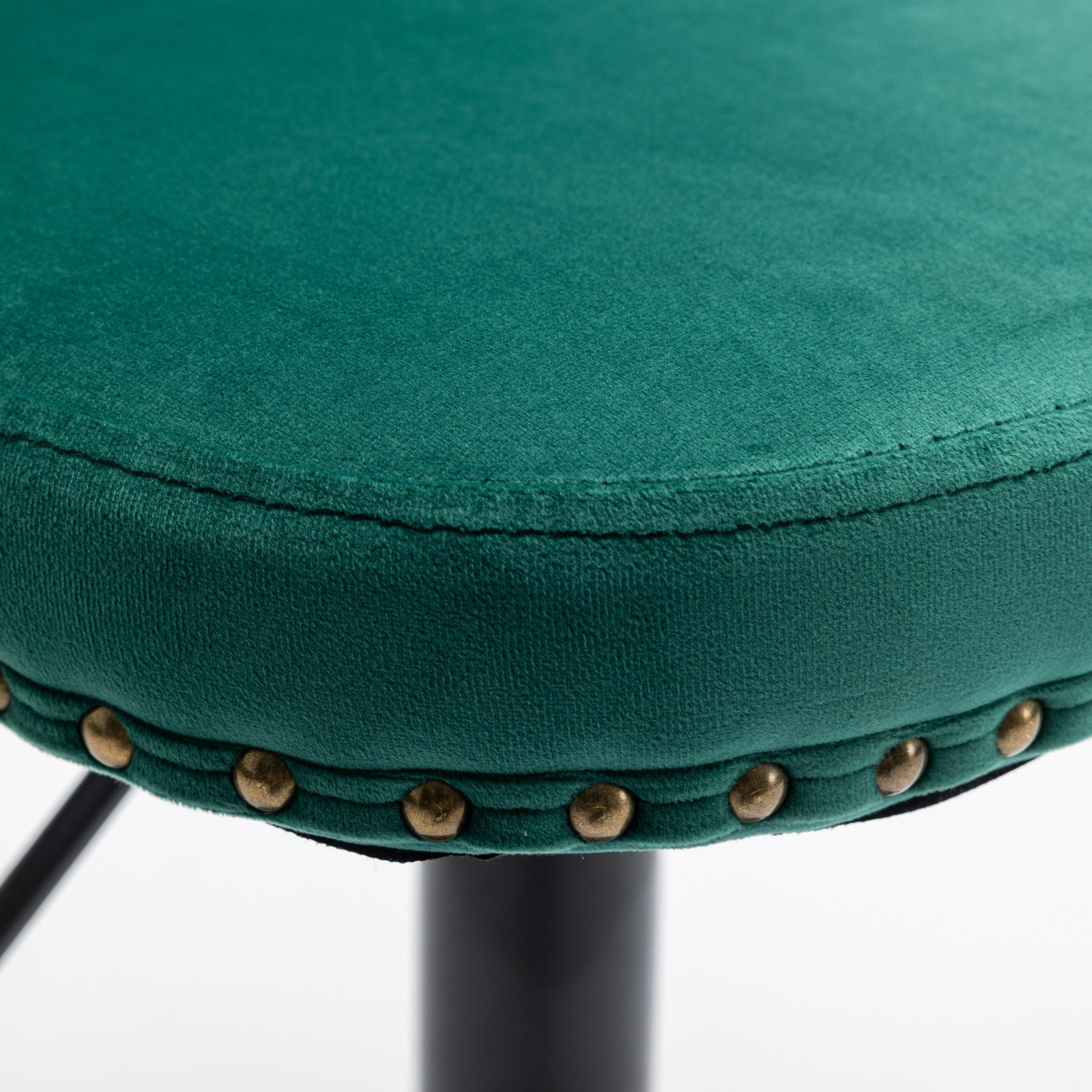 Emerald green velvet stool seat detail with brass nailhead trim