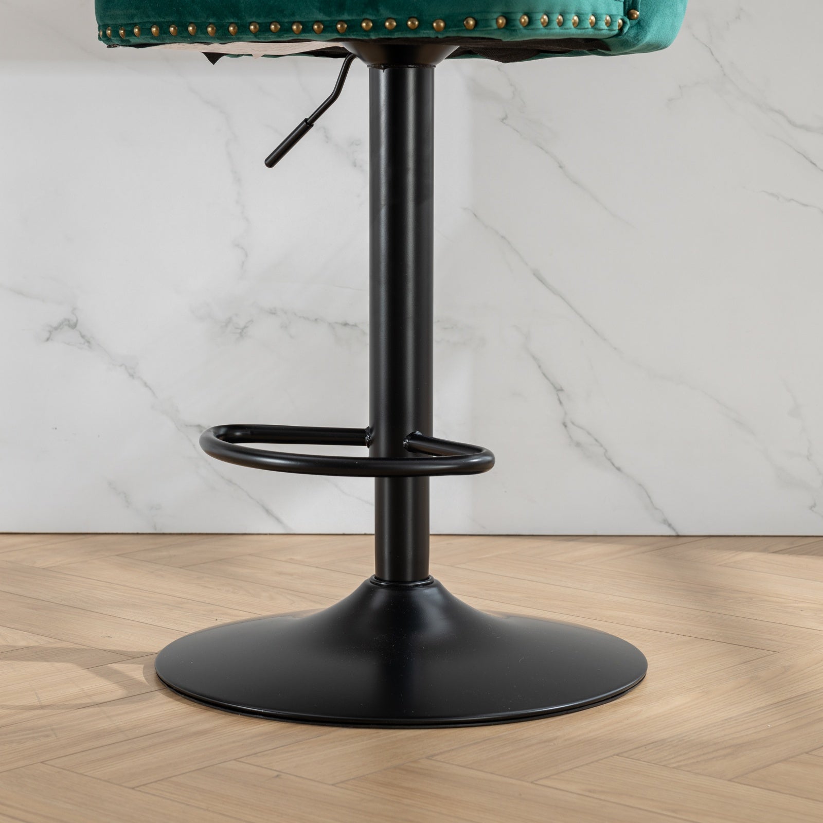 Emerald velvet bar stool with gold nailhead trim and adjustable height