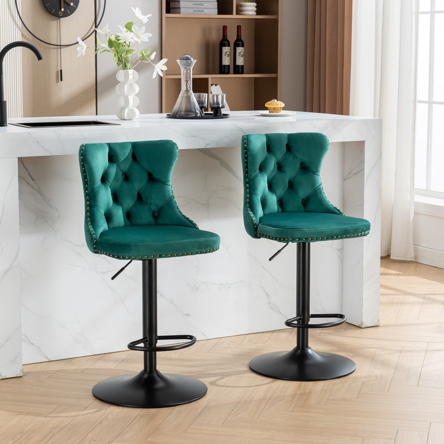 Emerald green velvet tufted bar stool with gold nailhead trim and black base