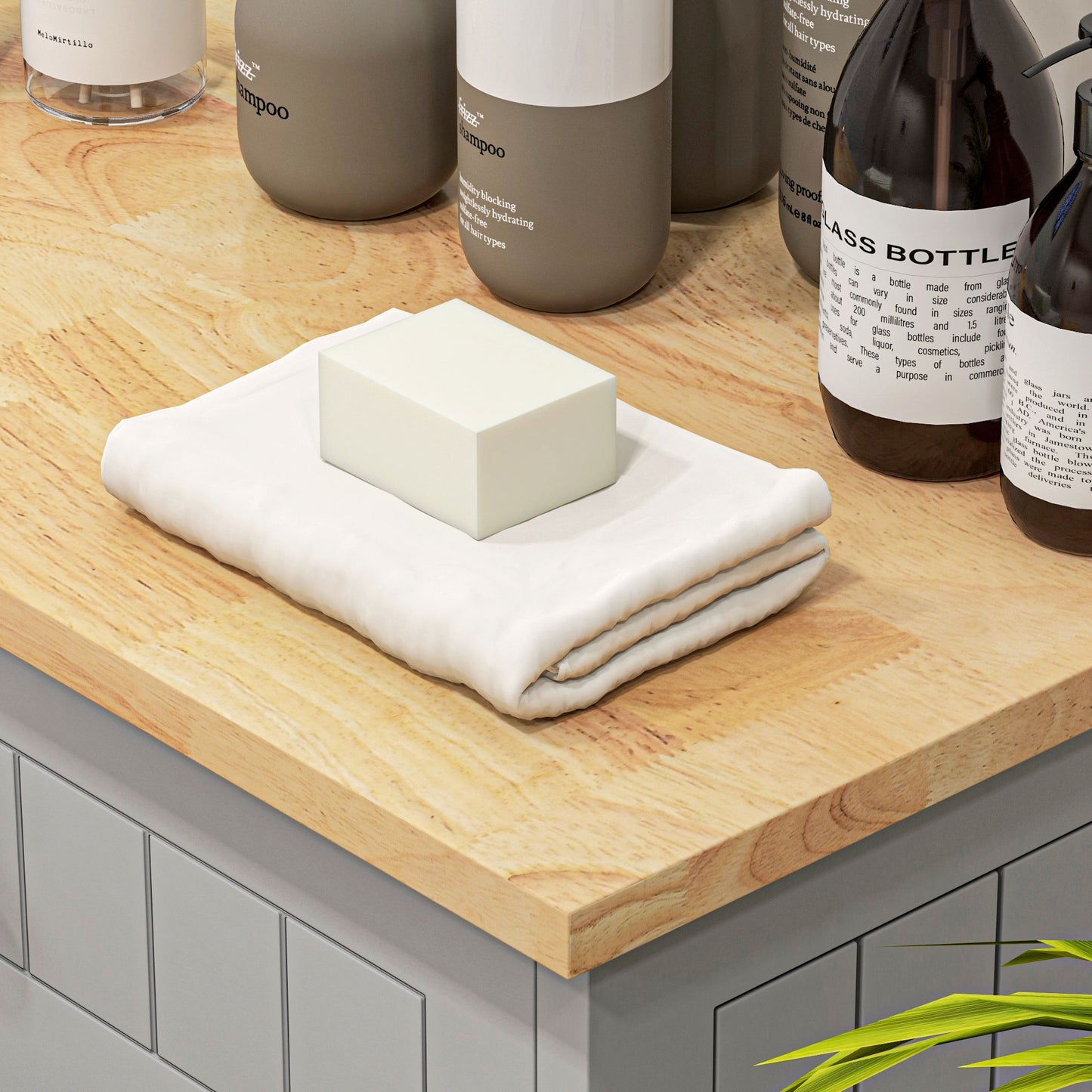 Cream bar soap resting on folded white towel