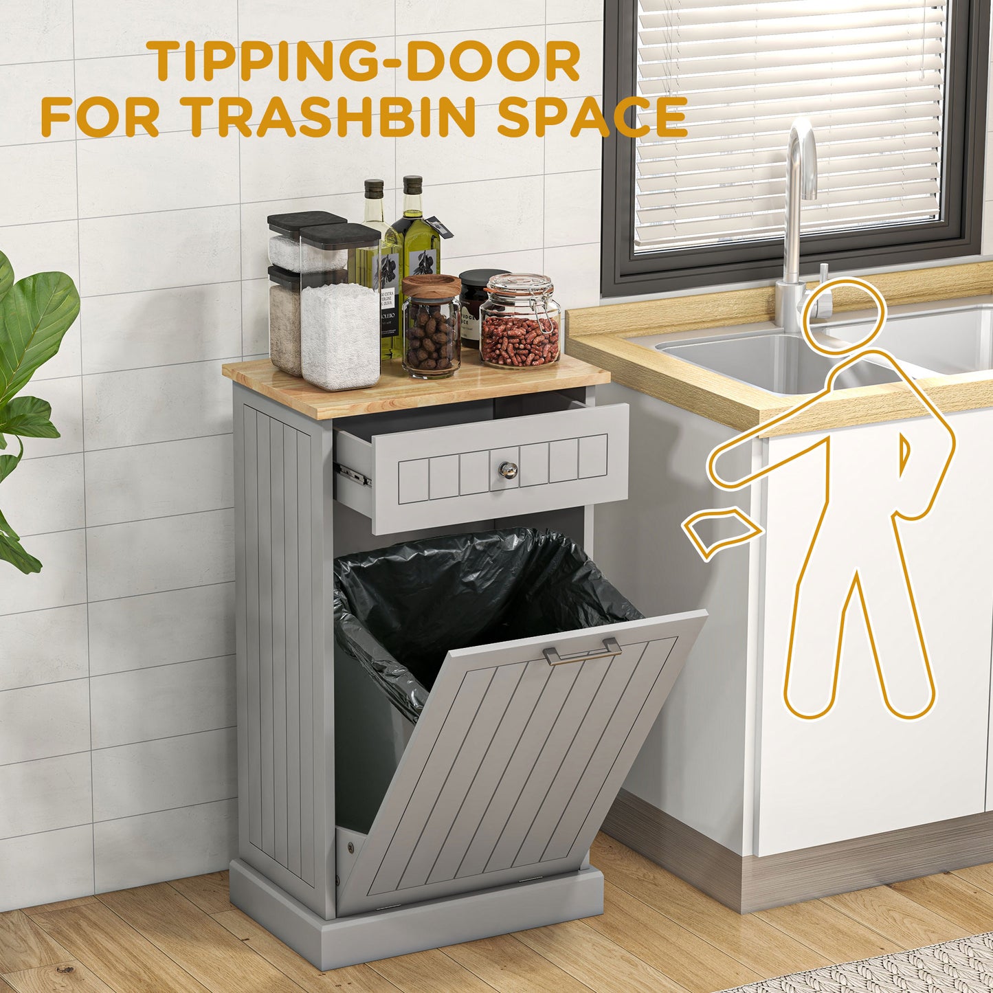 Gray kitchen trash bin cabinet with tipping door and top drawer