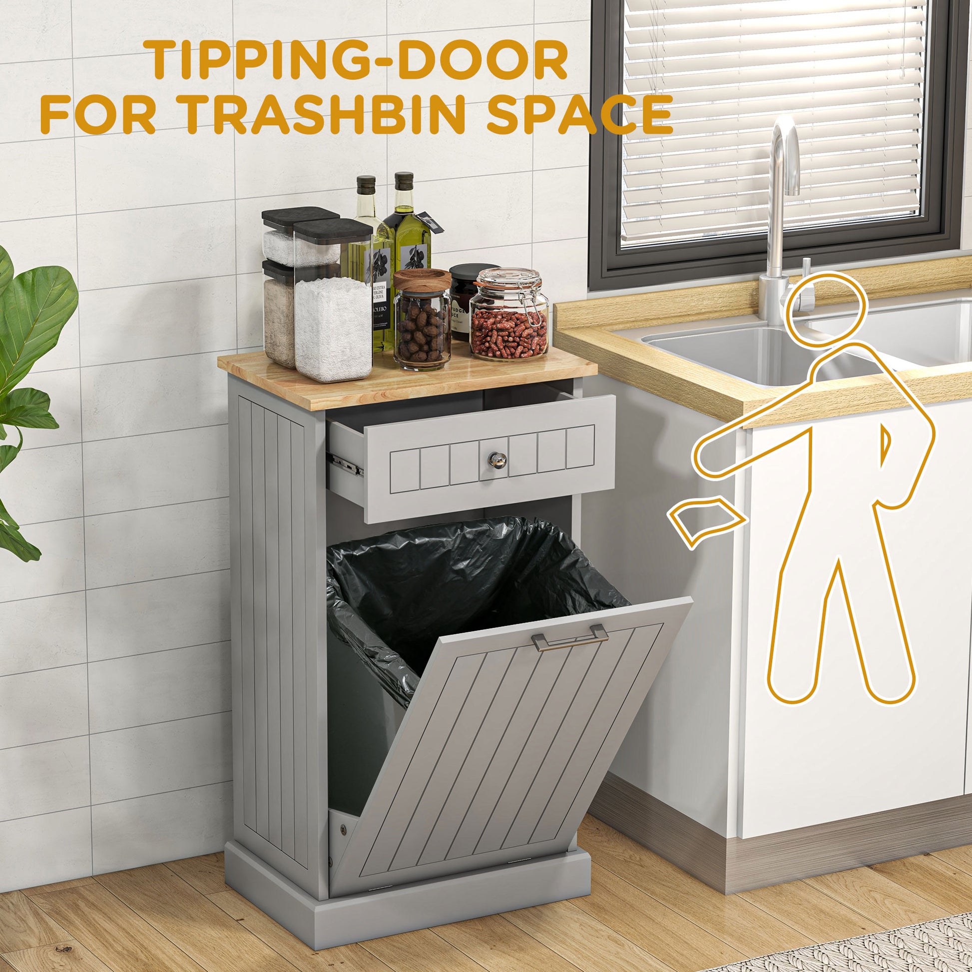 Gray kitchen trash bin cabinet with tipping door and top drawer
