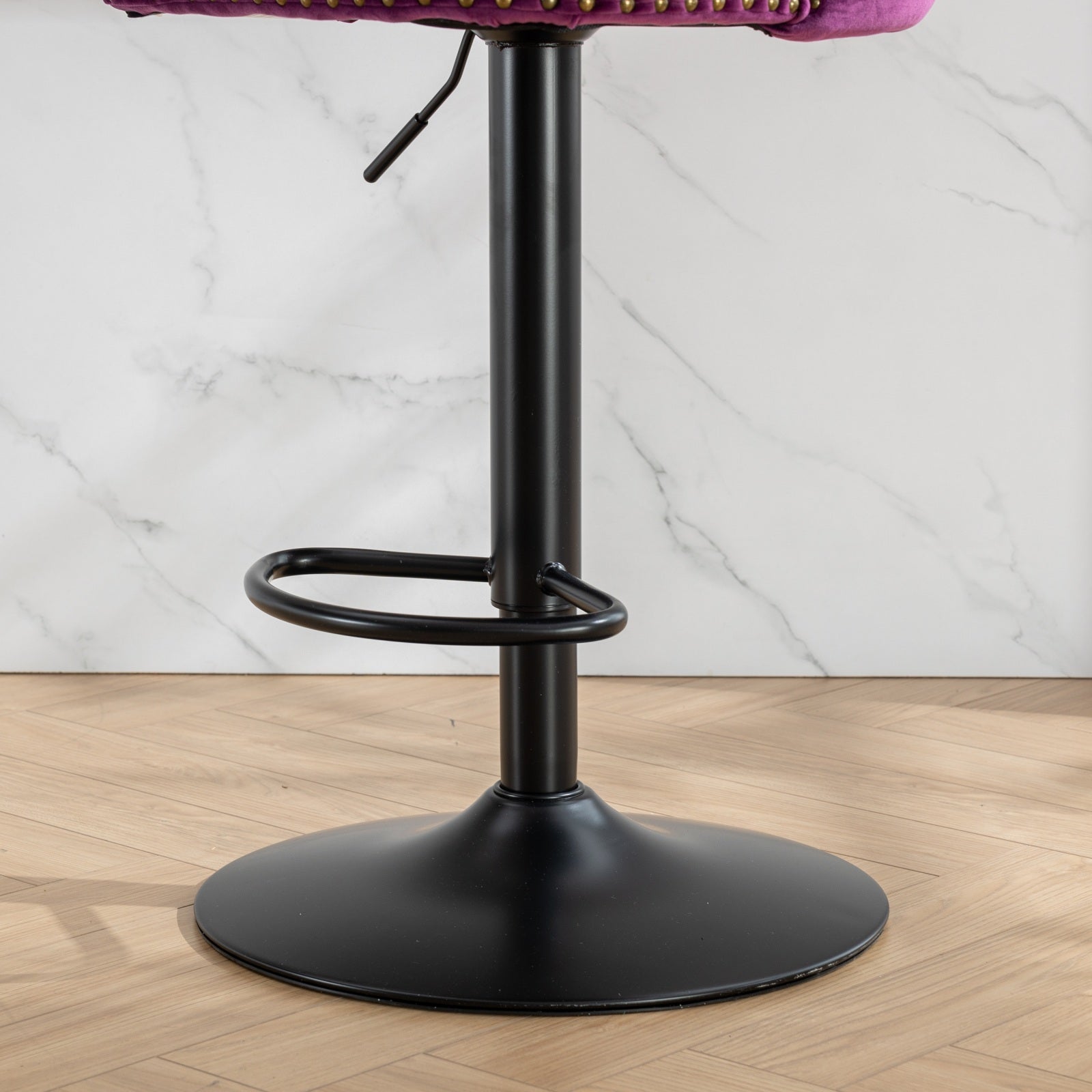 Adjustable height bar stool base with black metal finish and footrest ring