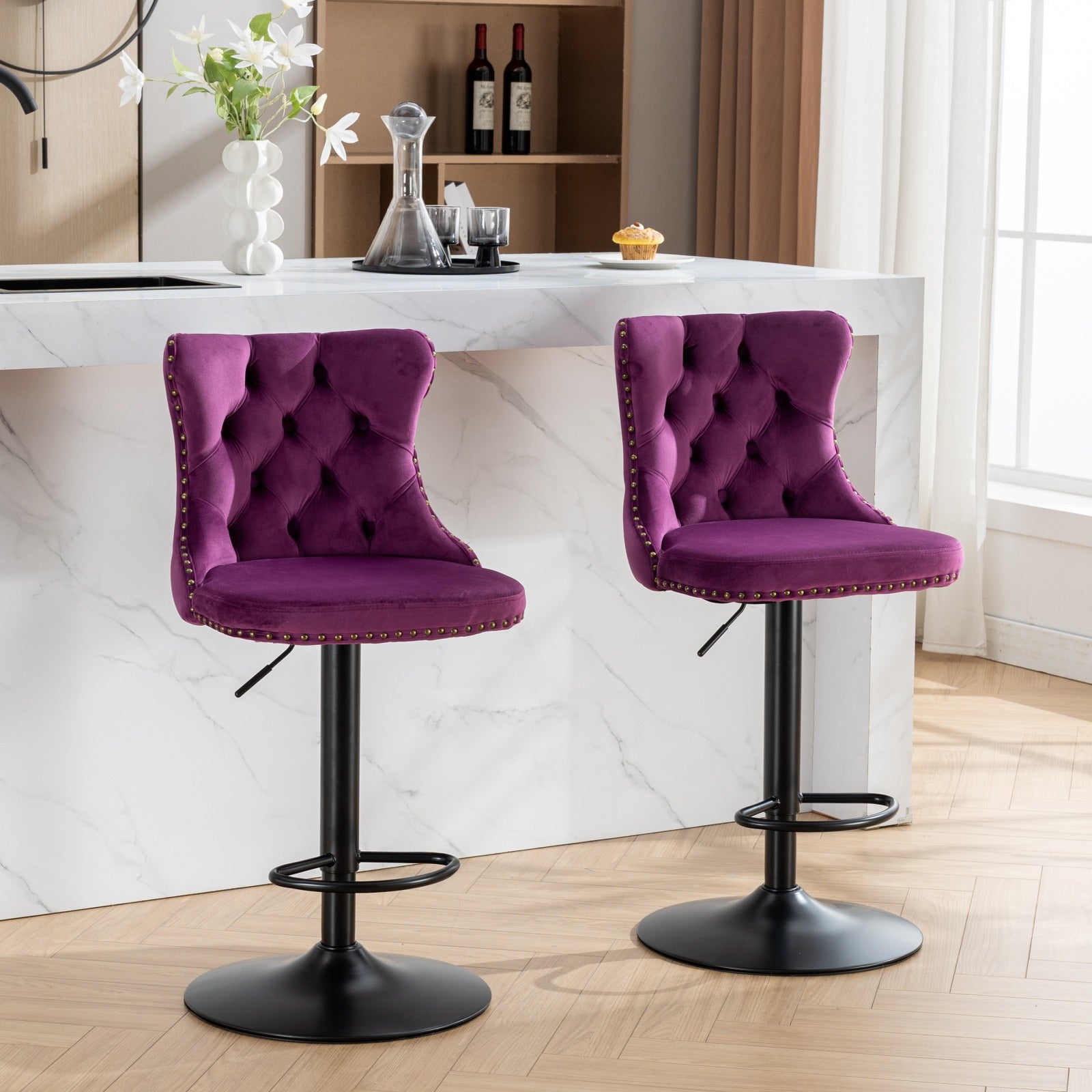 Two plush purple velvet tufted bar stools with nailhead trim featuring adjustable height and black metal bases