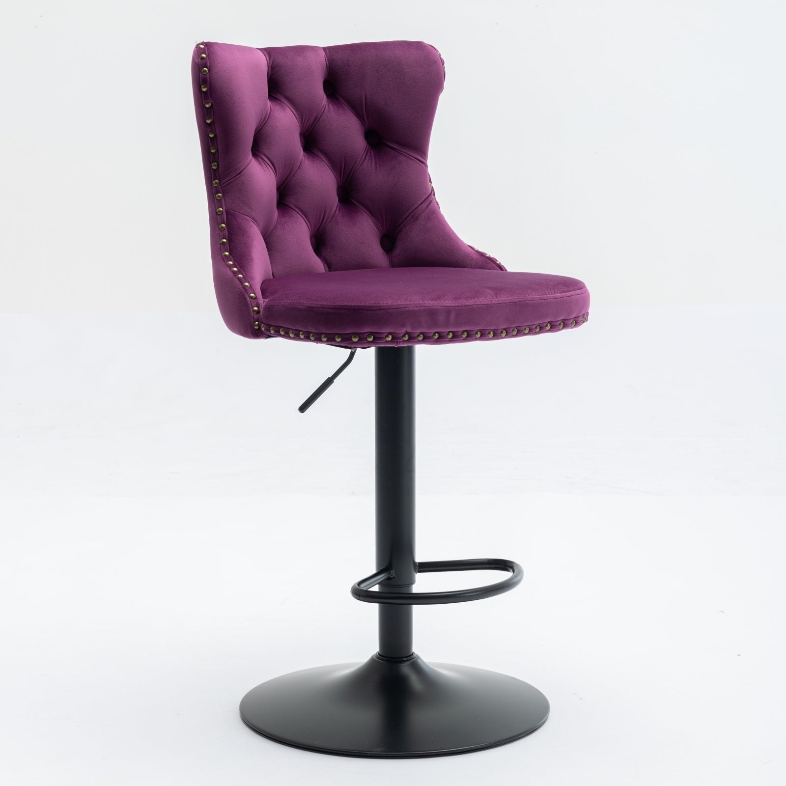 Purple velvet tufted bar stool with brass nailhead trim and adjustable height