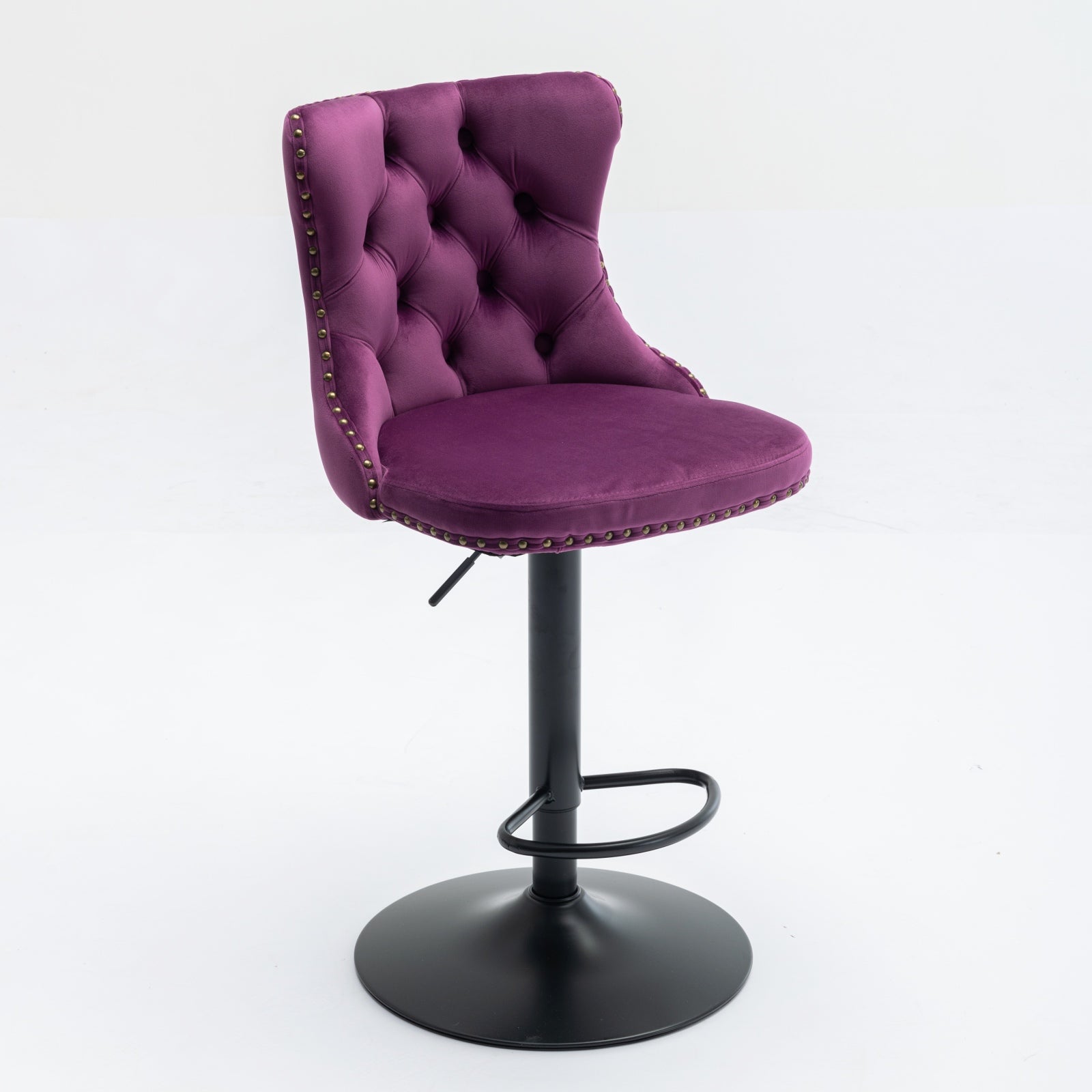 Deep purple velvet tufted bar stool with brass nailhead trim and adjustable height