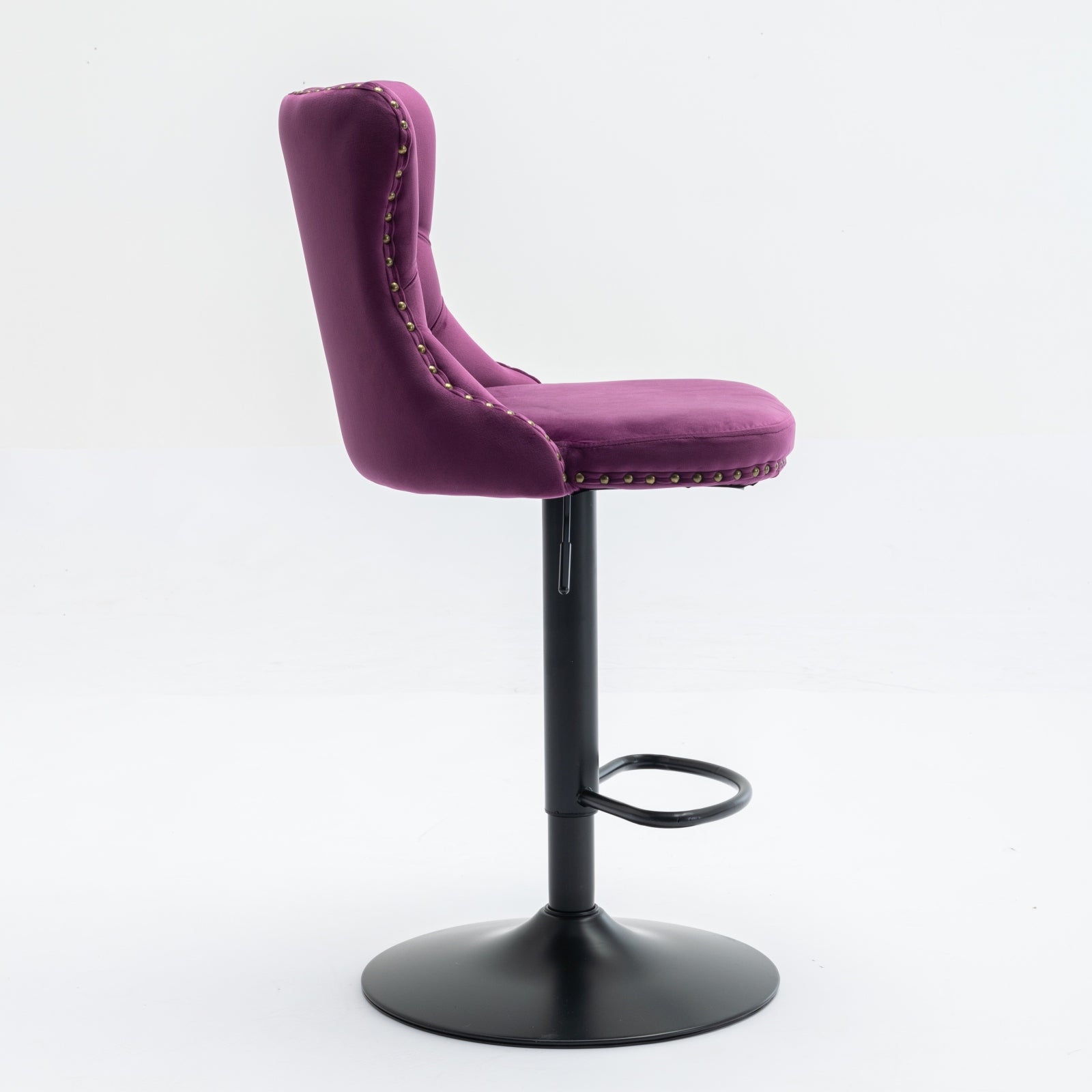 Purple velvet bar stool with button tufting and brass nailhead trim