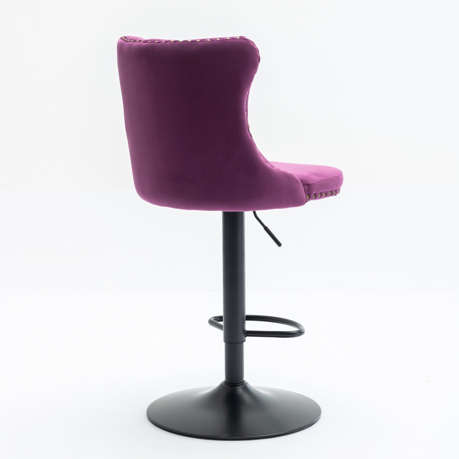 Plush purple velvet bar stool with tufted backrest and brass nailhead trim