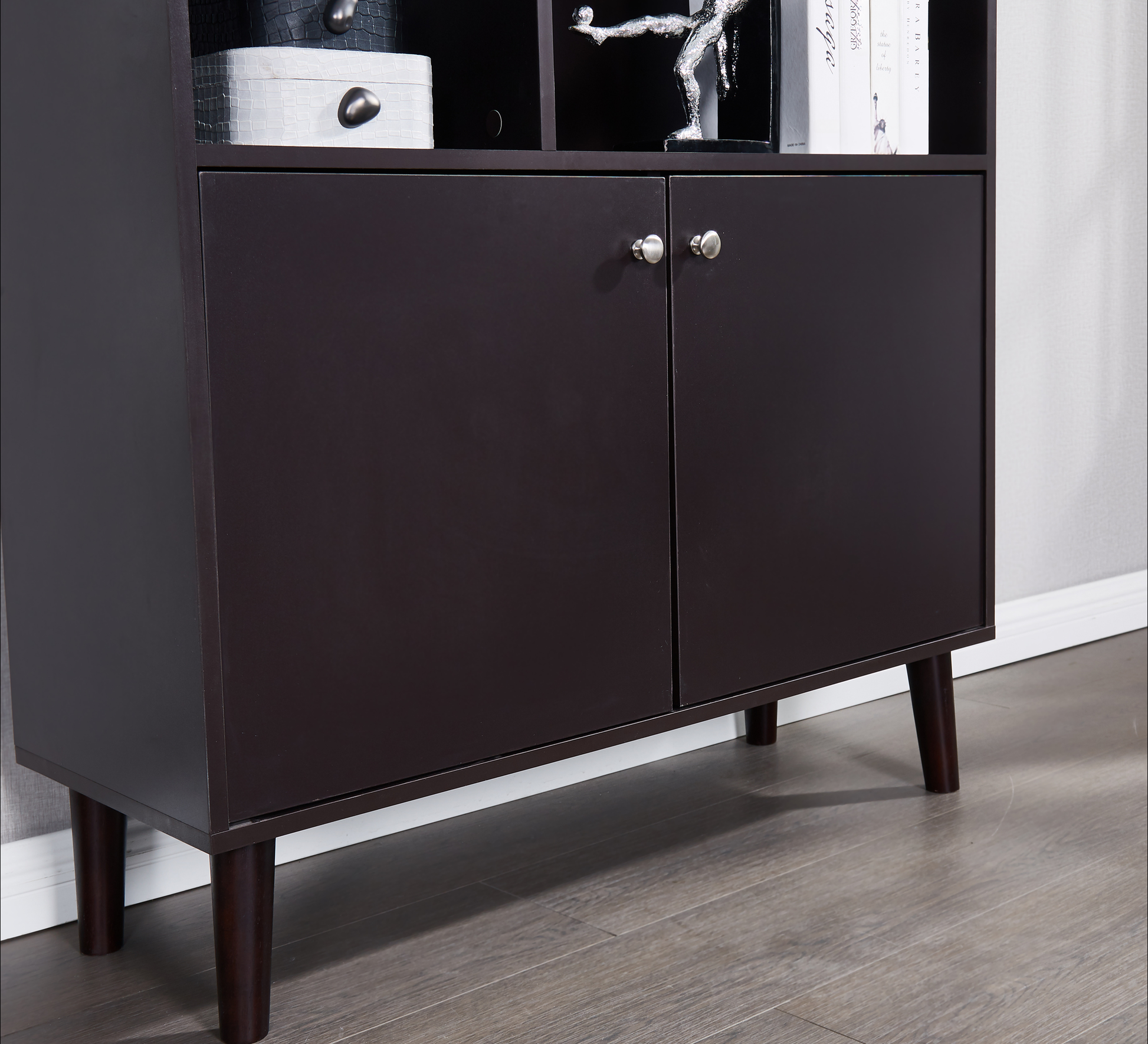Dark brown wood cabinet with two doors and silver knobs