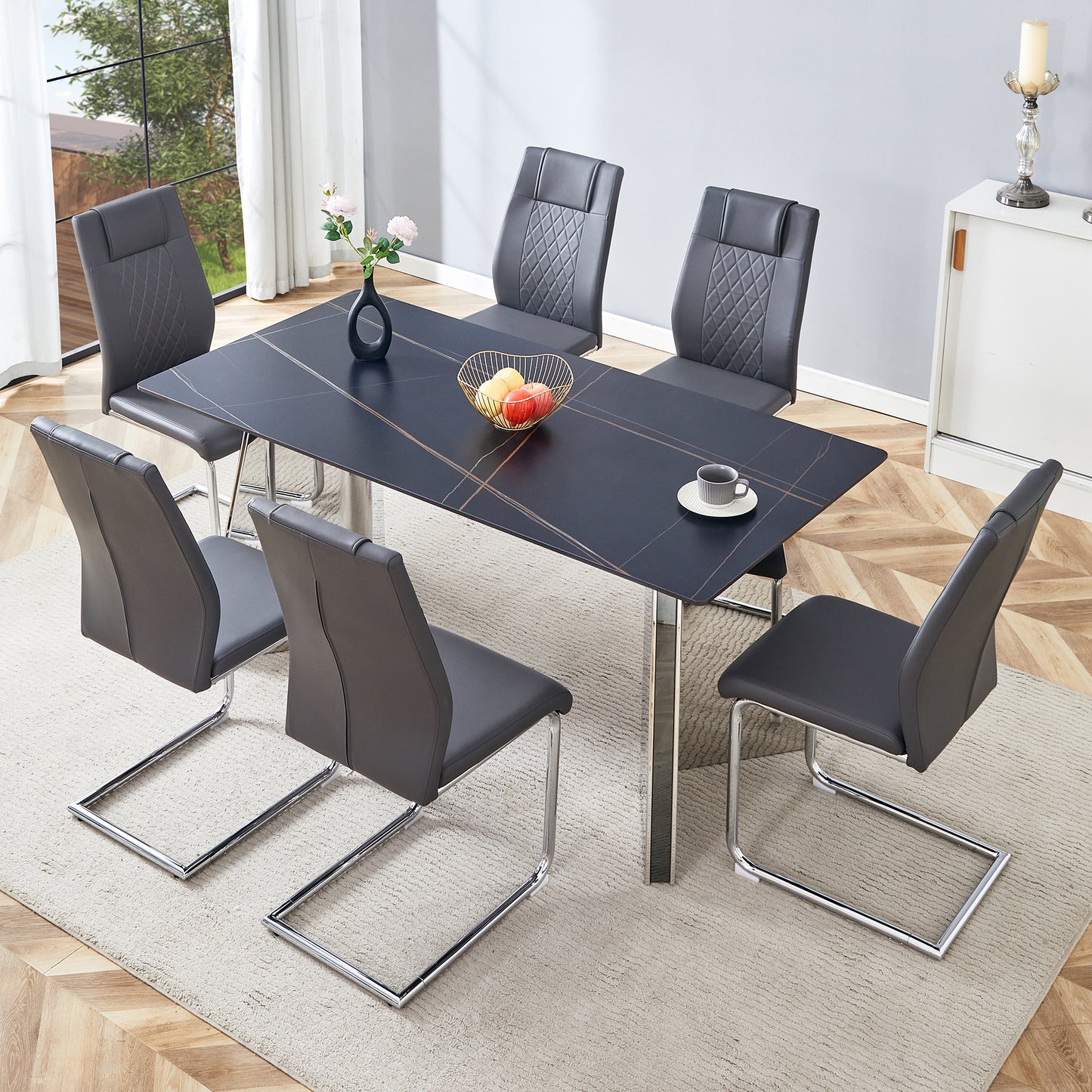 Sleek grey faux leather dining chairs with quilted backs and chrome cantilever legs