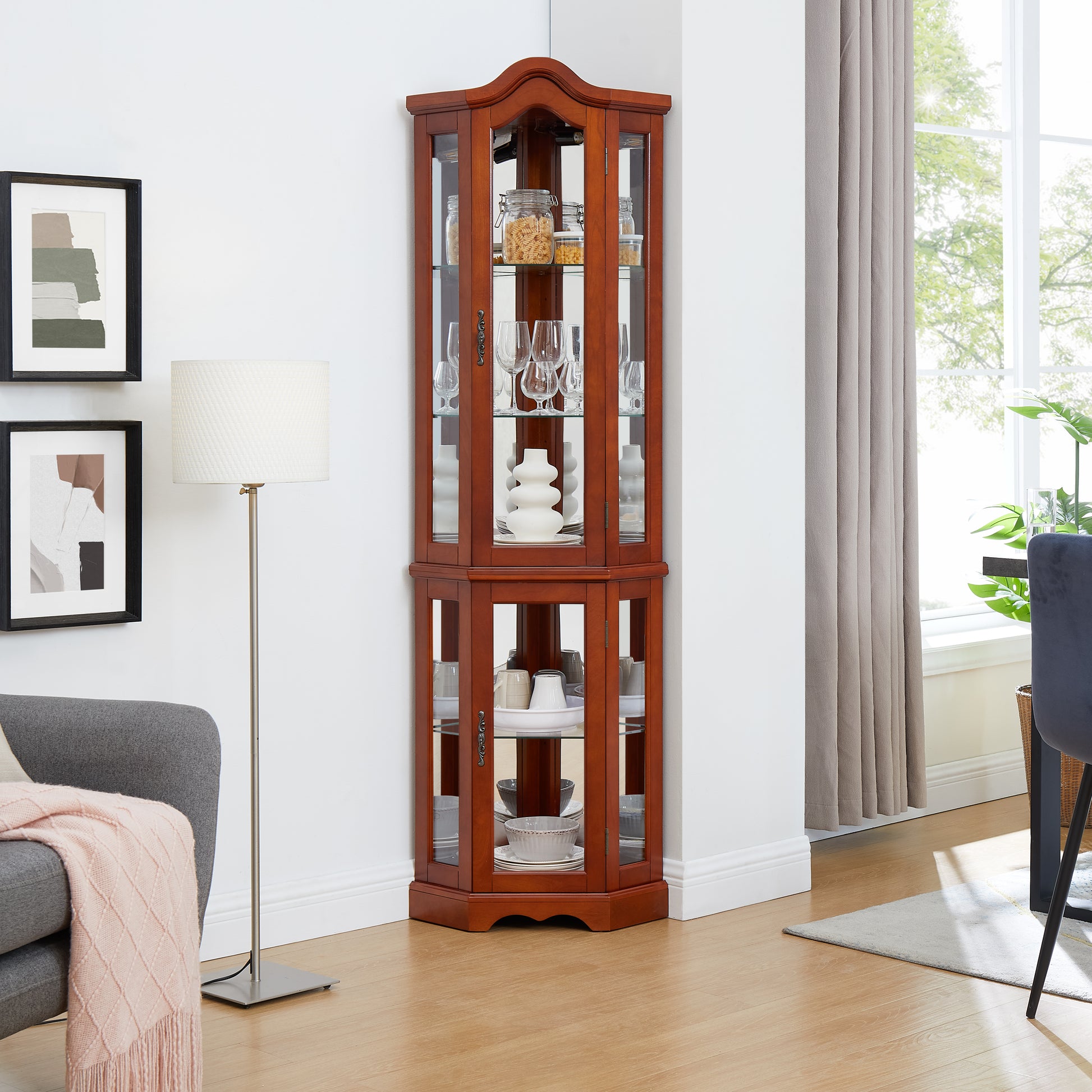 Elegant cherry wood corner curio cabinet with glass doors and shelves displaying dishware