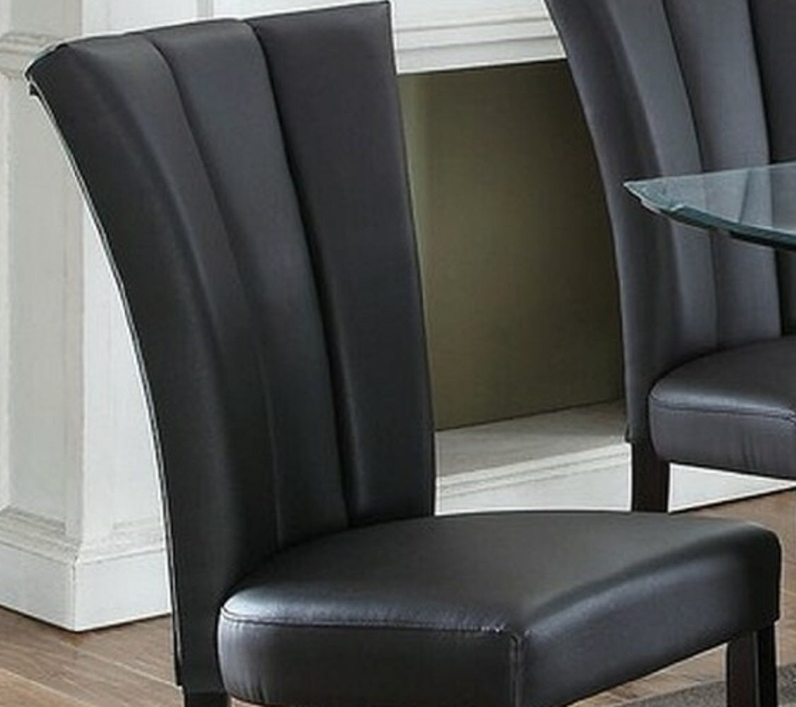 Black faux leather dining chair with channel tufting