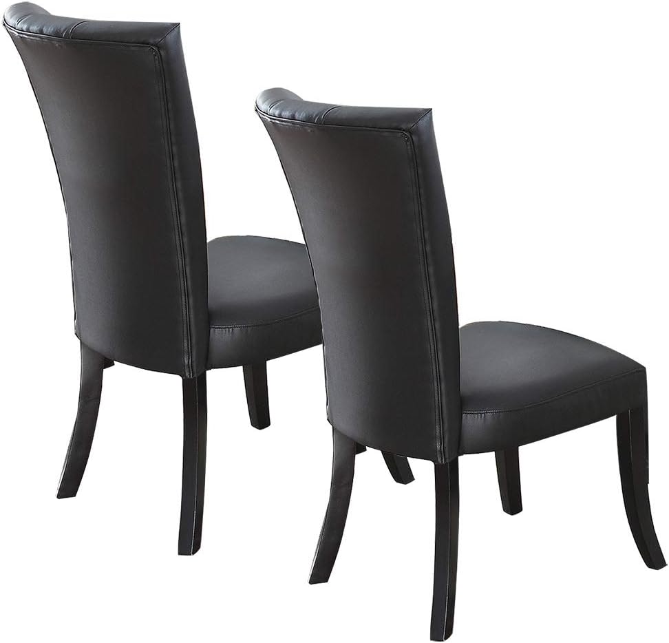 Dark brown leather dining chairs with curved backs and dark wood legs