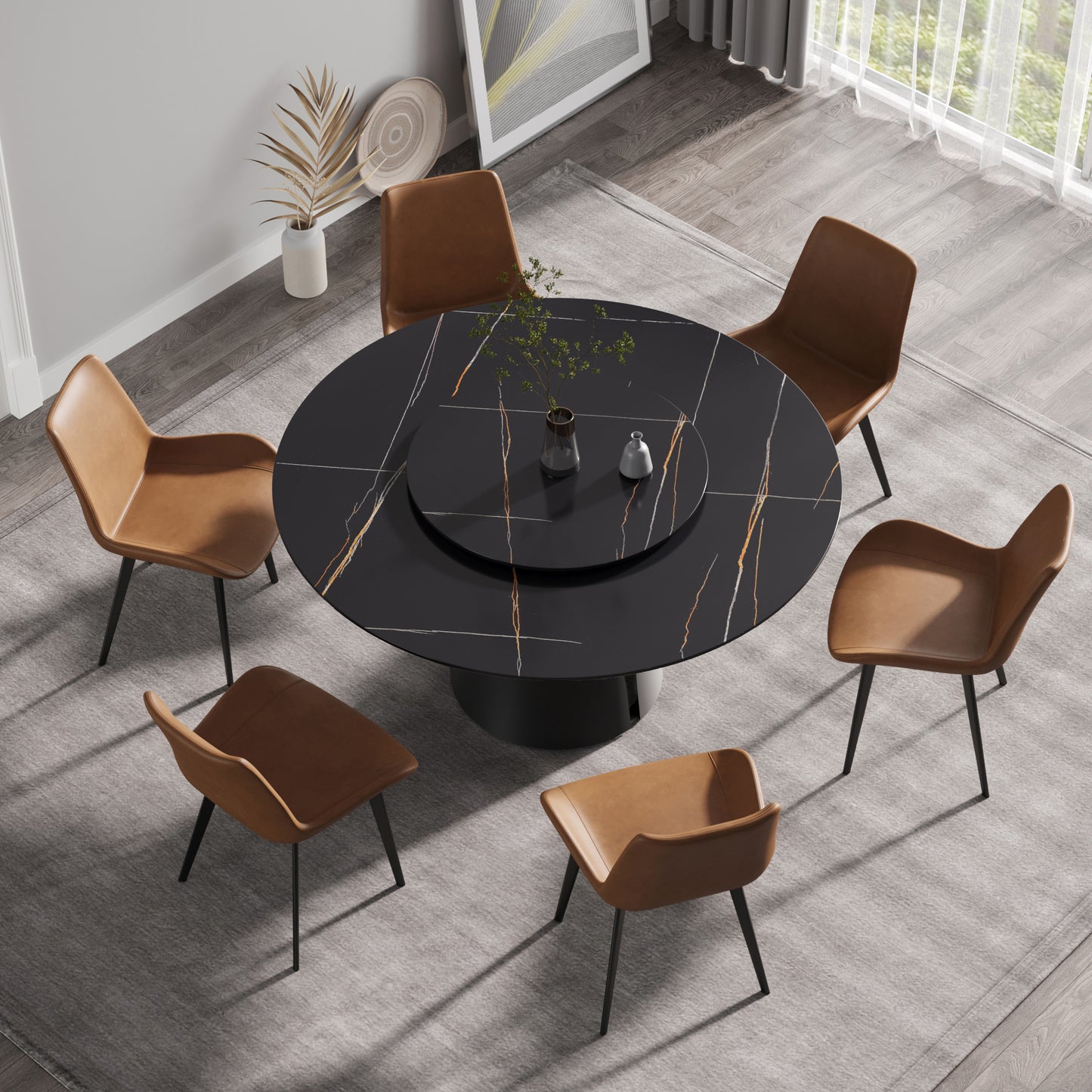 Round black marble dining table with brass inlay and six brown leather chairs