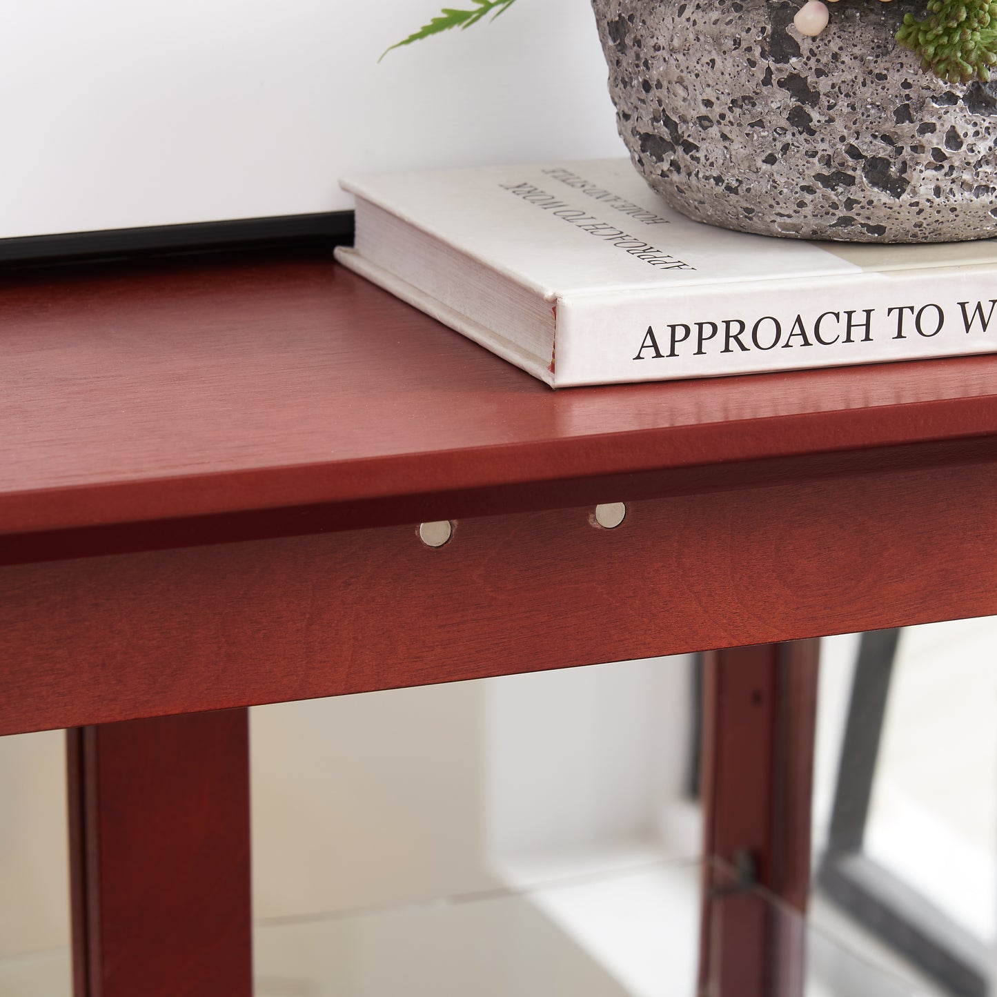 Rich mahogany wood desk surface with subtle grain detail
