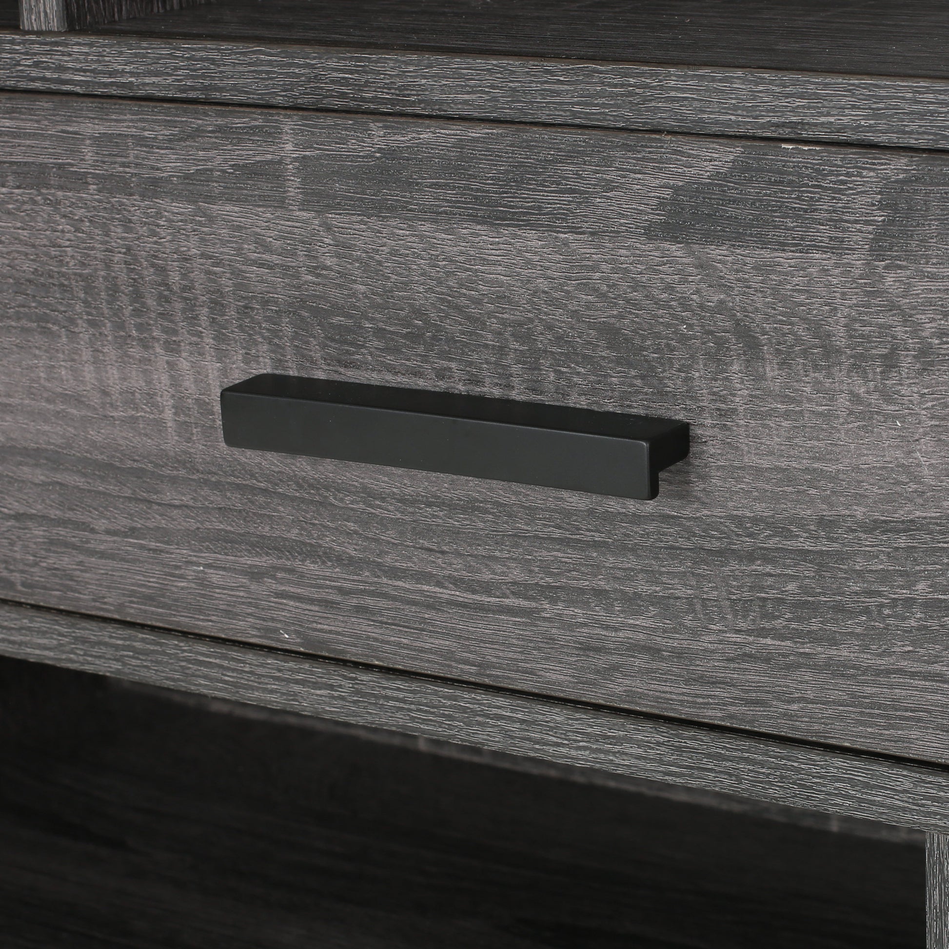 Dark grey wood grain dresser drawer with black handle