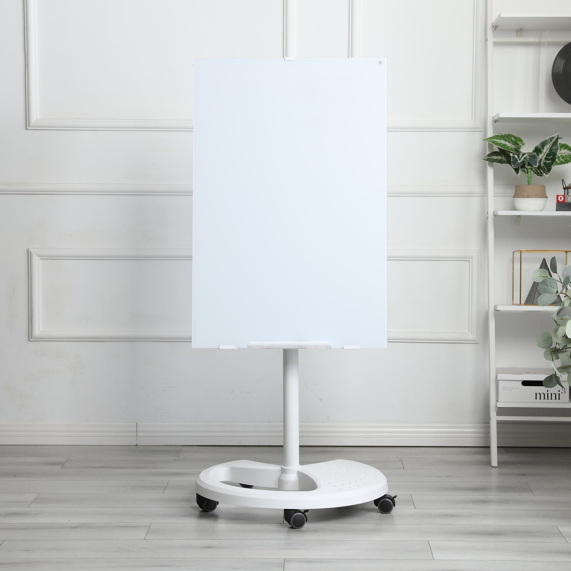 White glass dryerase board on rolling stand for office use