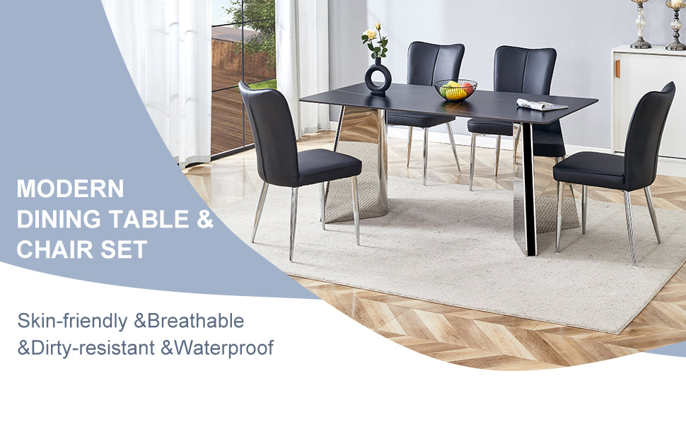 Black faux leather dining chairs with silver legs around a modern black dining table with a chrome pedestal base
