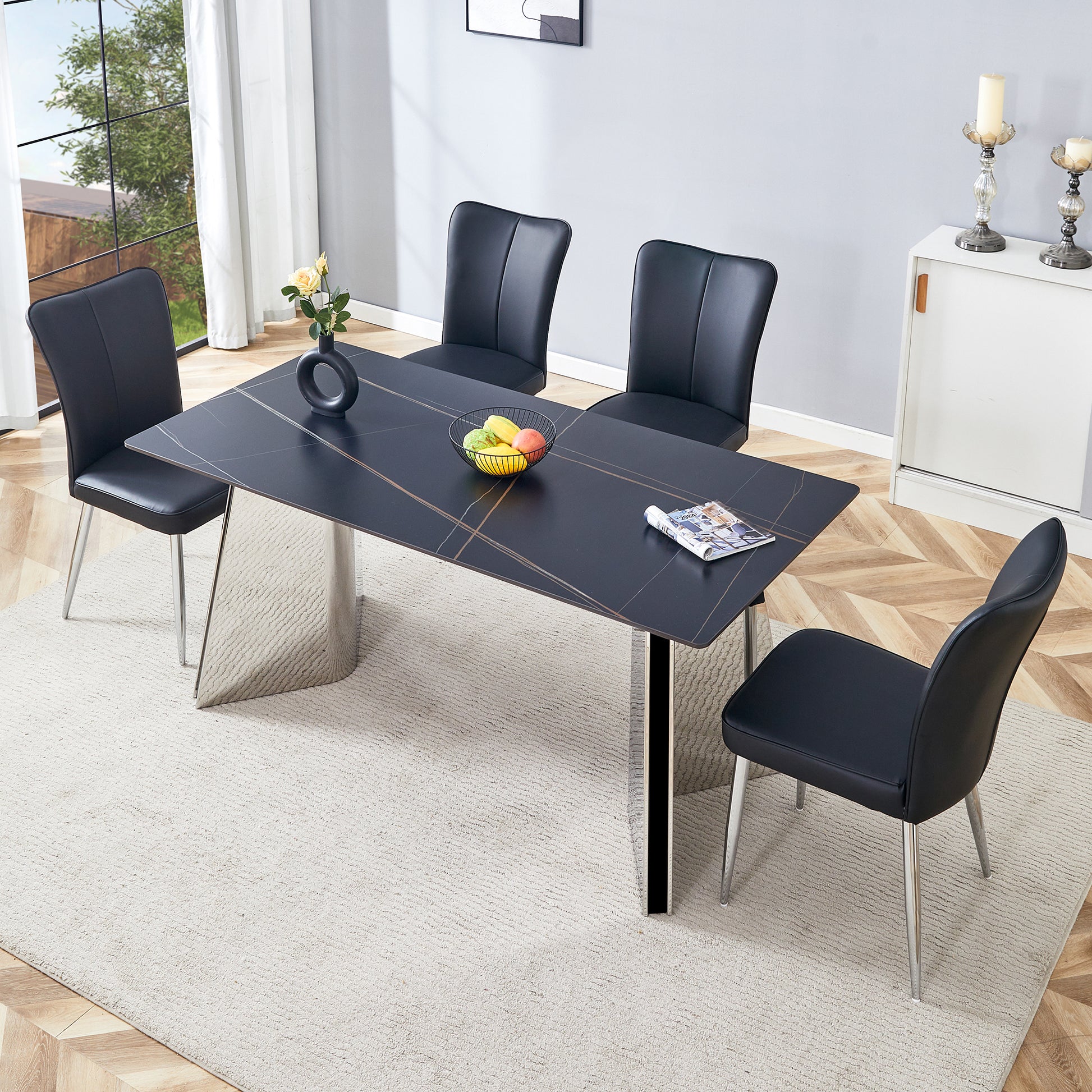 Black faux leather dining chairs with polished chrome legs