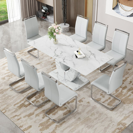 Modern white marble dining table with eight light gray faux leather cantilever chairs
