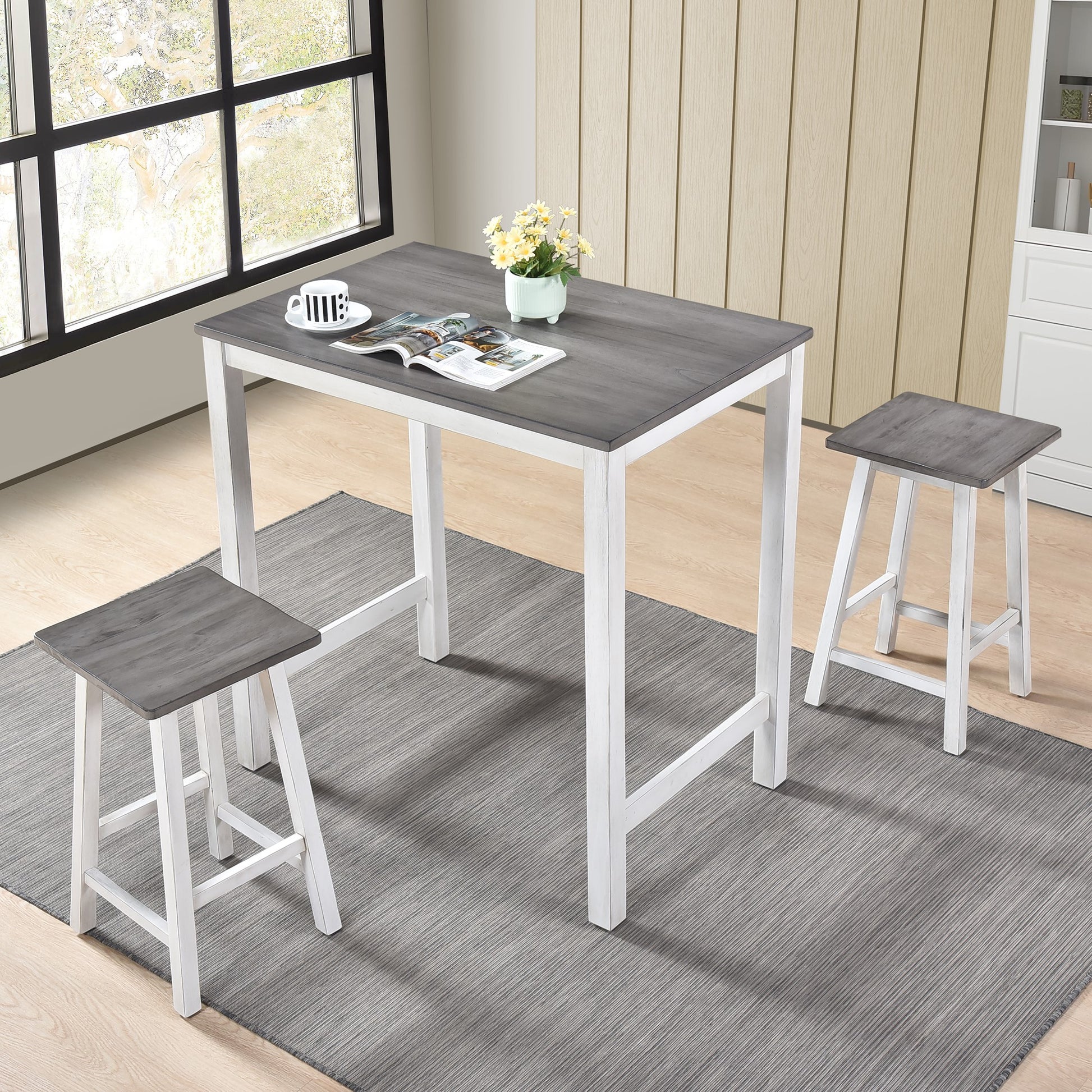 Gray wood top bar table with two white leg stools