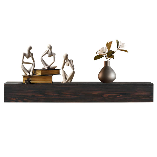 Abstract thinker sculptures in stone finish on a dark wood shelf