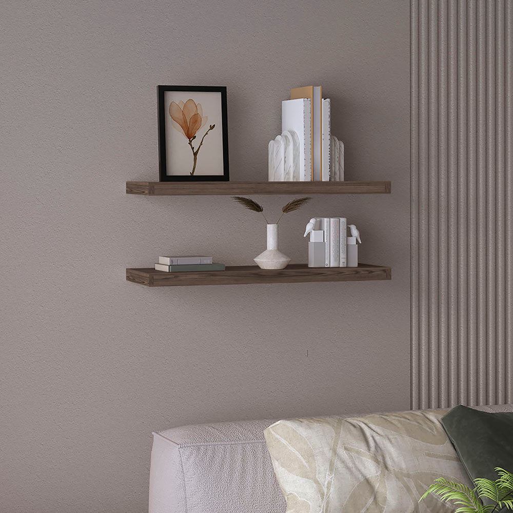 Dark oak floating shelves display artwork and books