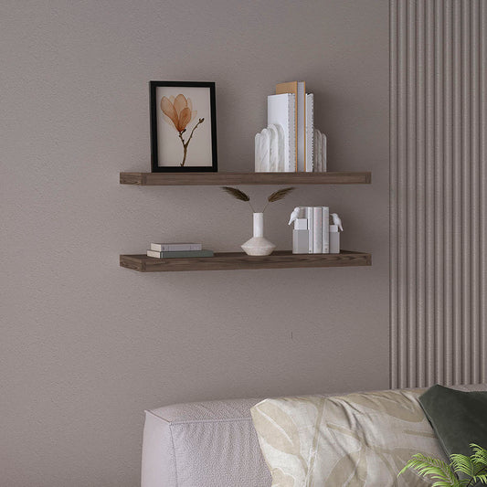 Dark oak floating shelves display artwork and books