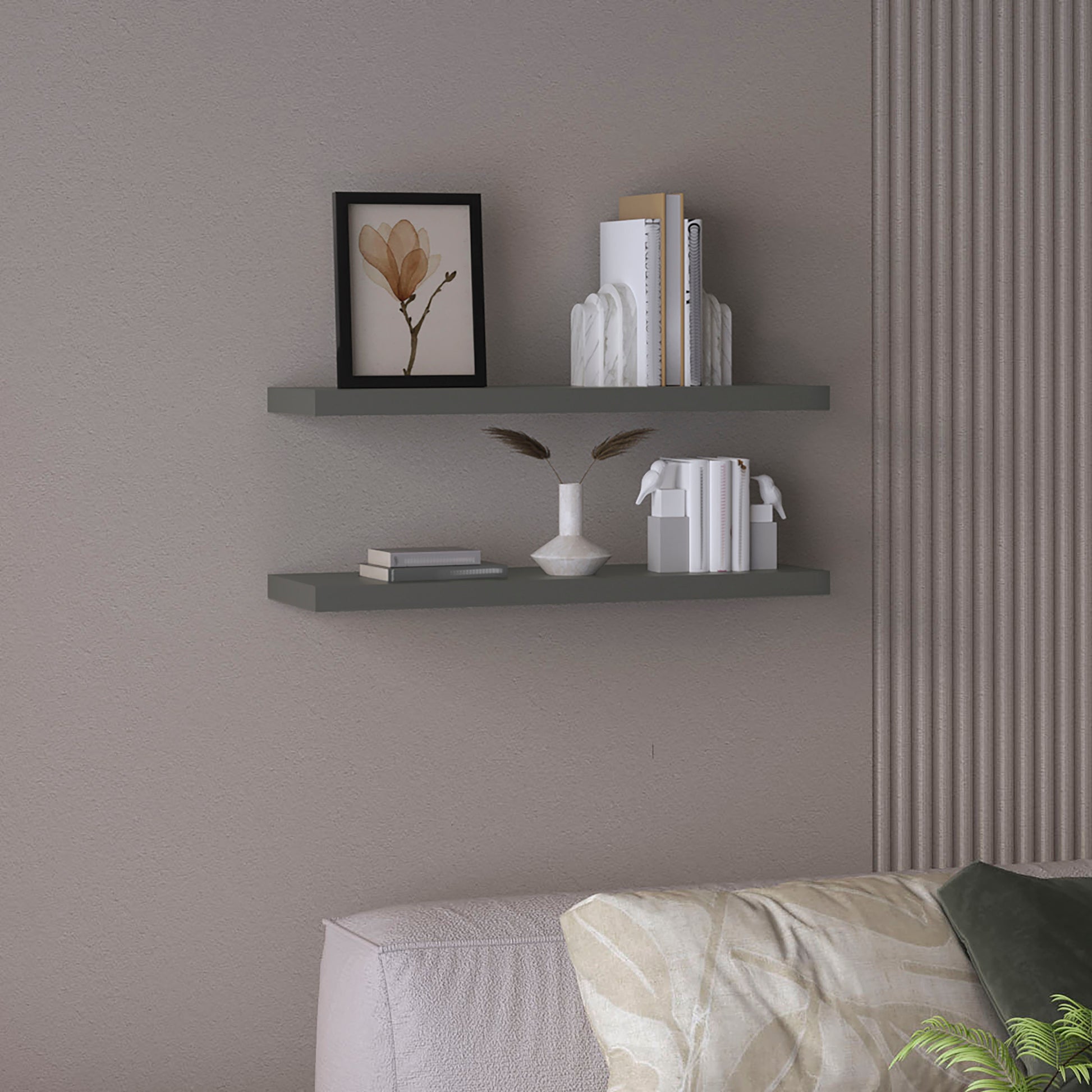 Modern grey floating shelves with decorative objects including books and a vase